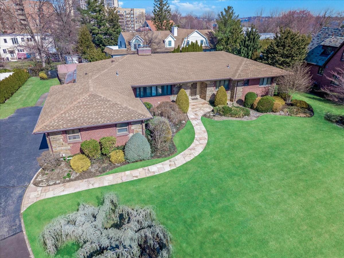 One of a kind Bayside Gables of Little Neck Bay property.  The property features a large sprawling, east wing and west wing ranch spanning over 2600 square feet across 1 floor.  The West wing features a large living room, a formal dining room, large sitting den with fireplace, eat-in-kitchen, mudroom and laundry room, half bath, and entrance to large, 2 car attached garage, .  The East wing features a large primary suite with a large primary bathroom and walk in closets, 2 generous sized bedrooms with a Jack and Jill full bathroom, and a hallway powder room. There is 2600 square foot basement with high ceilings and 2 stair egress’s. The property is located, private, patrolled streets in a gated enclave in Bayside.  The beautiful 1970 custom built home is on a 19,000 plus square foot lot with 121 feet of frontage. The backyard offers  a patio, with lowered pool deck to an in ground heated pool area.  Large greens and landscaping offers so much privacy.  School District 26, Near All, major highways, shopping MTA busses, Long island Railroad.