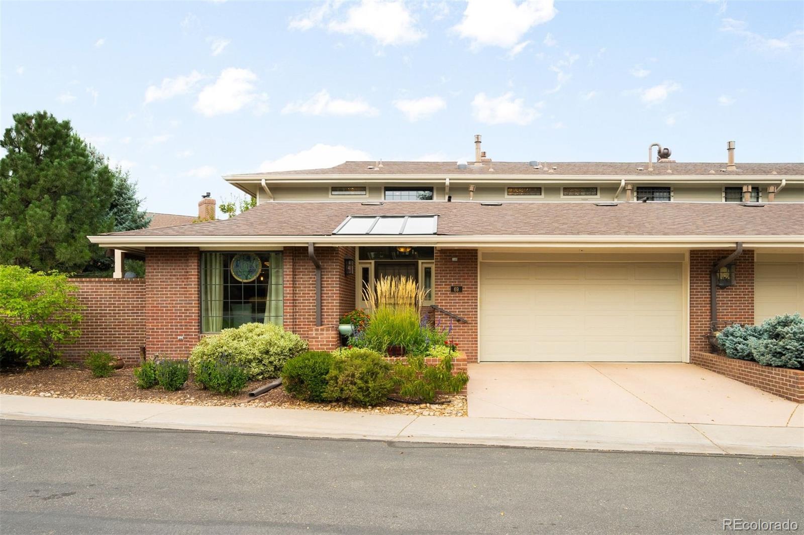 Welcome to this beautifully updated and meticulously maintained 2-story home in the sought-after Cherry Hills III community. Tucked away in a private Denver location, this residence offers tranquil outdoor living with brick patios, retractable awnings, and the soothing sound of a nearby stream. Inside, floor-to-ceiling windows, vaulted ceilings, and a cozy fireplace create a light-filled living space. The gourmet kitchen features GE Profile and Bosch stainless steel appliances, with a formal dining area and bar nearby—perfect for entertaining. A breakfast nook opens to a private side patio, ideal for morning coffee or evening wine. The main-level suite (currently a family room) includes a fireplace, en-suite bath, and private patio. Upstairs, enjoy a spacious loft, guest room, and a second primary suite—each with a private balcony, walk-in closet, and en-suite bath.The finished basement offers a bedroom with en-suite bath, wine cellar, kitchenette, and two flexible living spaces. New furnace and A/C (2022). Cherry Hills III amenities include a clubhouse, pool, spa, tennis courts, and vibrant social events—true resort-style living in the heart of Denver.