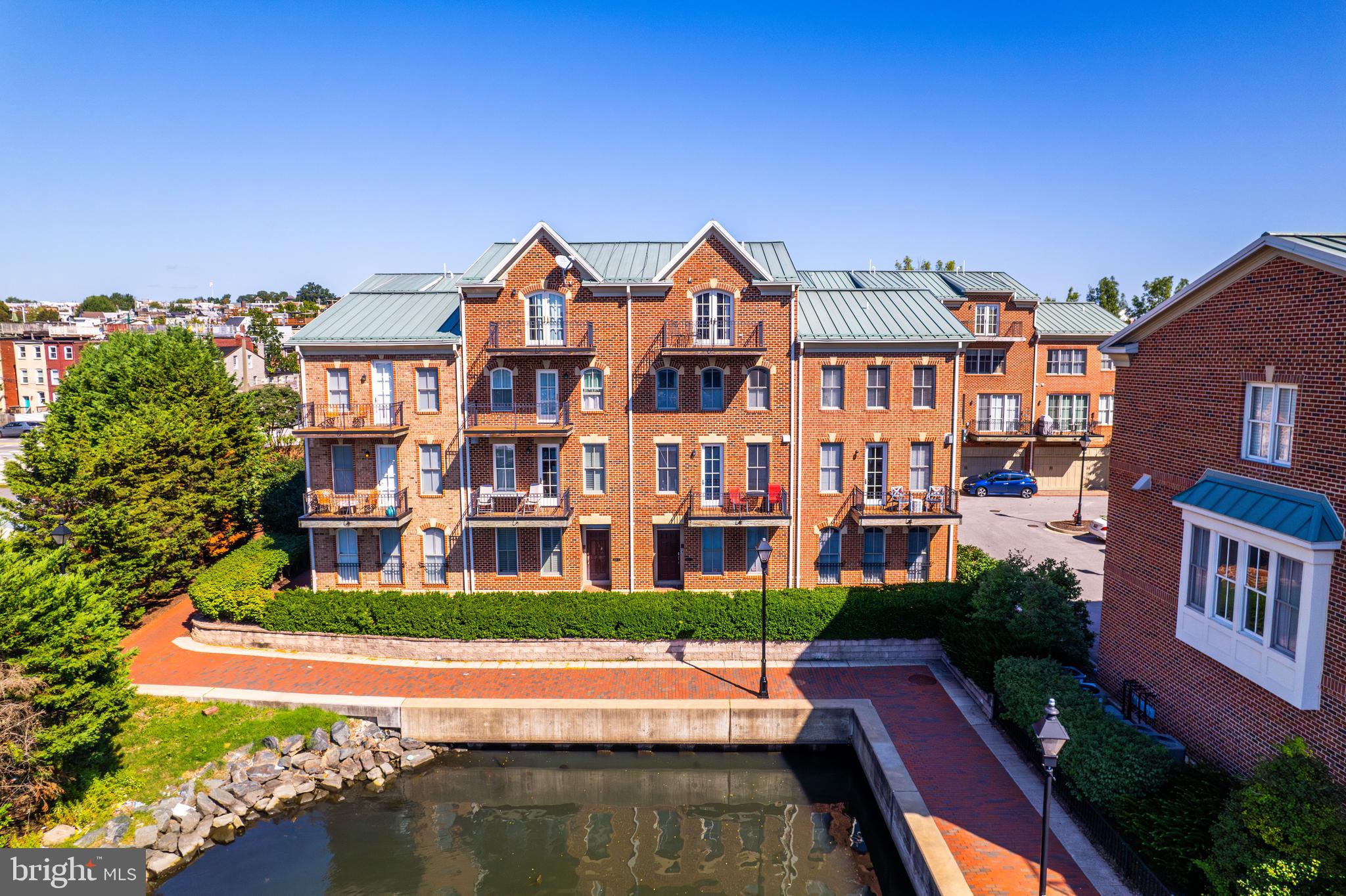 Welcome to North Shore a Sought after Community located on the Canton Waterfront.  Situated between fells and Canton.  This 3 Bedroom 3.5 Bath Waterfront Townhome offers a 2 car garage with one extra space.  The first level as you enter has a flex space, can be used as an office guest bedroom workout room etc. open entry Full bath and closet space and access to the garage. As you enter the main living area, The gourmet kitchen is a chef's dream with Viking appliances and a kitchen island for entertaining your guests. Open the balcony door and have outdoor space overlooking the water.  This open-concept living and dining area are bathed in natural light, enhancing the inviting and airy feel of the home.  A half bath is located on the main level for your guest. As you enter the 3rd level you will find a 2nd living area full bath and 2nd  bedroom.  laundry is located on this level.  4th level is the Primary Suite with private balcony, his and hers walk in closets, his and hers sinks,  jacuzzi and an oversized shower.  Come check out this Waterfront Oasis .  Located near parks restaurants, and shops steps to fells point and O'Donnell Square.   Close to major highways, top hospitals.  Experience living like you are on Vacation everyday.