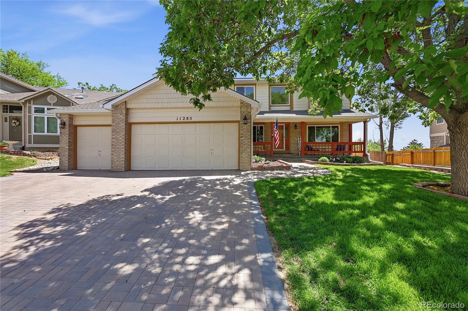 Stunning Panorama Ridge 2-story situated on one of the largest lots in the neighborhood with over 17,000 square feet of beautifully maintained grounds. This spacious home offers 5 bedrooms, 4 bathrooms, over 3,600 finished square feet, and an oversized 3-car garage complete with an attached storage shed. Designed with larger and multi-generational families in mind, the home features an exceptional floor plan with generous living spaces throughout. The upper level boasts 4 large bedrooms and 2 full baths, including a luxurious primary suite with a 5-piece bath, oversized walk-in closet, and plenty of room to relax. The secondary bedrooms are thoughtfully separated from the primary suite and enjoy convenient access to a full bathroom. The main level offers a welcoming living room, formal dining room, and a spectacular great room with soaring vaulted ceilings, abundant natural light, and a cozy gas fireplace. The spacious kitchen is beautifully updated with new quartz countertops, a center island, breakfast bar, large pantry, and an expansive breakfast nook perfect for family gatherings. The professionally finished basement provides outstanding additional living space with a large recreation room, media room, 3/4 bath with an attached sauna, hardwood flooring, recessed lighting, an impressive open staircase, and a large storage area. Recent improvements include a stunning paver stone driveway and front porch, fresh interior paint throughout including ceilings and basement, updated furnace and central air conditioning, newer Pella and Andersen windows and storm doors, new gutters, added soffit vents, and an insulated and sealed attic for enhanced energy efficiency. The expansive yard is fully equipped with a sprinkler system in both the front and rear yards, the large lot offers room for outdoor entertaining, play, and relaxation. This exceptional home combines size, quality, and location to create a rare opportunity in one of the area's most desirable neighborhoods.