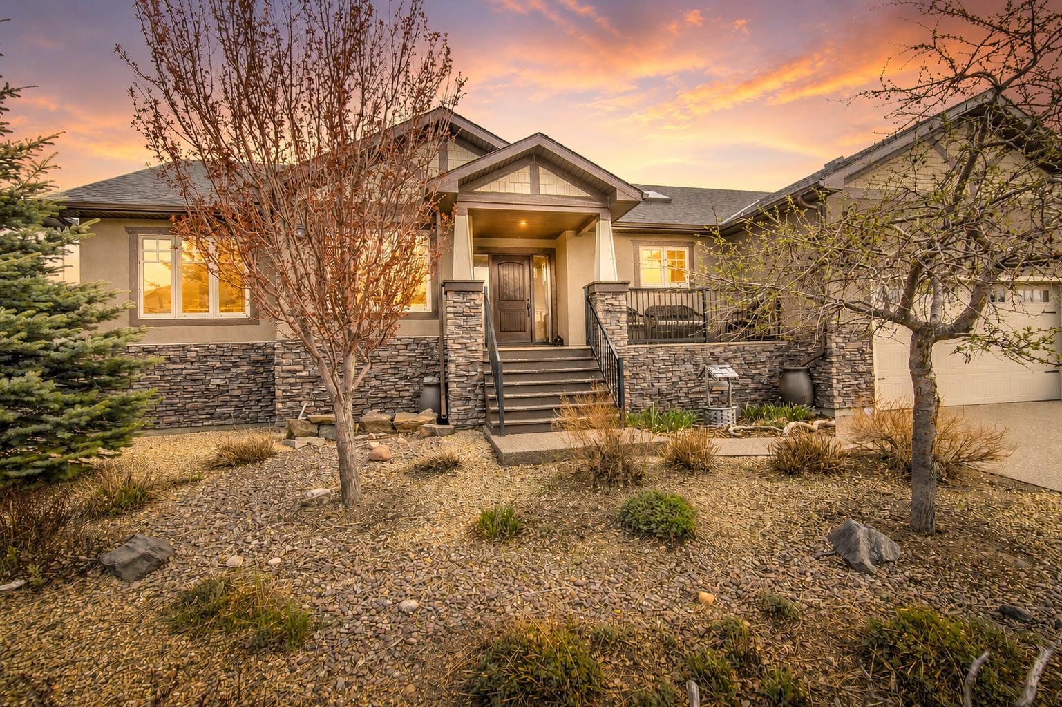 Discover luxury living in the exclusive community of Paradise Pointe with this exceptional craftsman-style bungalow backing directly onto the coulees of Paradise Canyon. Situated on a beautifully landscaped and fenced 79’ x 123’ lot, this executive home offers over 3,300 sq. ft. of fully developed living space designed for upscale comfort and entertaining.The bright open-concept main floor is filled with natural light and showcases premium finishes throughout, including granite countertops, a custom birchwood kitchen, and rich knotty alder doors and trim. With 5 bedrooms and 3 bathrooms, and room to spare, this home offers flexibility for families, professionals, and guests alike.The fully developed basement features a massive recreation room, wet bar, and additional entertaining space, while the large deck and patio overlook the stunning coulee landscape. Additional highlights include an oversized double attached garage, integrated solar panel system, built in home stereo system, and a prestigious west Lethbridge location near Paradise Canyon Golf Resort.A rare luxury bungalow offering privacy, craftsmanship, and breathtaking natural surroundings in one of Lethbridge’s most sought-after neighbourhoods.