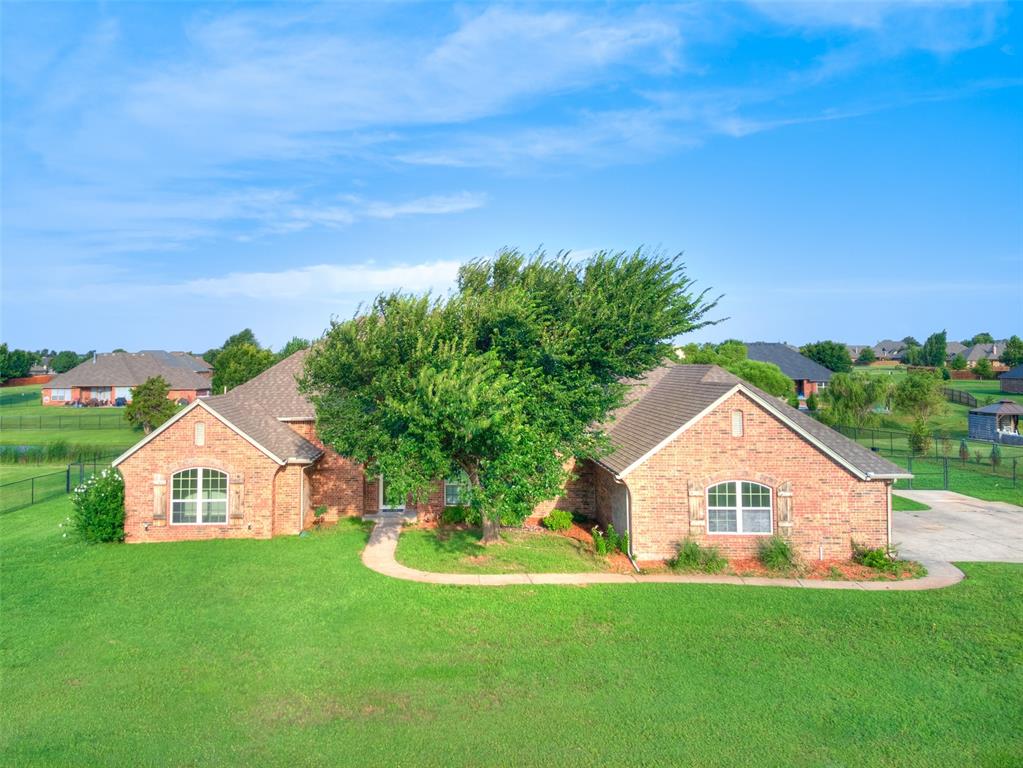 Don't miss this BEAUTIFULLY updated home in highly sought after Deer Creek School District sitting on just over an acre! Fresh paint throughout entire home, new carpet, updated plumbing fixtures and so much more make this home move-in ready! Plenty of room to spread out and entertain whether you're enjoying the back patio, fishing just off your back yard in the stocked neighborhood pond, or entertaining inside with your separate formal dining area downstairs or your huge bonus room upstairs...there's room for everything! The primary suite offers a separate tub/shower, double vanities and a big walk-in closet. Enjoy the Oklahoma sunsets from your back porch in a quiet neighborhood with stocked fishing pond, playground, basketball court and easy access to HWY 74. Welcome HOME!