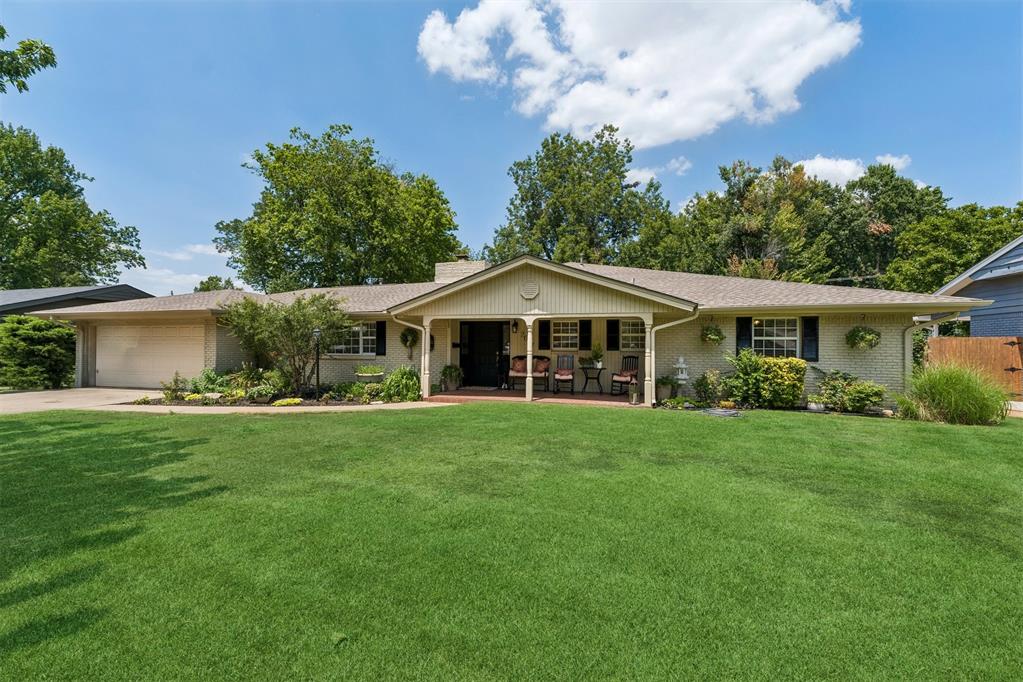 Welcome to this stunning ranch-style home nestled in the heart of core Norman! Located in one of the city's most established and desirable neighborhoods, you'll love being just minutes from fantastic restaurants, shopping, and convenient I-35 access while enjoying the charm of mature trees and a welcoming community. From the moment you arrive, this home captures your heart with its inviting curb appeal and spacious covered front porch—the perfect place to enjoy your morning coffee or relax with friends and neighbors. Step inside to a light-filled interior where a dramatic wall of windows showcases the expansive backyard and fills the home with natural light. Beautiful wood-look tile flooring flows throughout the living areas, kitchen, and formal dining, creating a warm and cohesive feel. The updated kitchen is both beautiful and functional, featuring granite countertops, stainless steel appliances, abundant cabinetry, a pantry, and generous prep space. The freestanding island can remain with the home, and the window above the sink offers a picturesque view of the oversized back patio—perfect for entertaining or simply enjoying the outdoors. With five spacious bedrooms, this home offers incredible flexibility for family, guests, home offices, or hobbies. The private primary suite features a large walk-in closet and the convenience of a utility room just off the suite—a thoughtful feature today's buyers appreciate. Three full bathrooms plus a convenient powder bath provide plenty of room for everyone. Two cozy masonry fireplaces add warmth and character, creating inviting spaces to gather year-round. Offering generous storage, timeless charm, thoughtful updates, and an unbeatable location, this exceptional home truly has room for everyone. If you've been searching for the perfect blend of comfort, character, and convenience, this is one you won't want to miss!