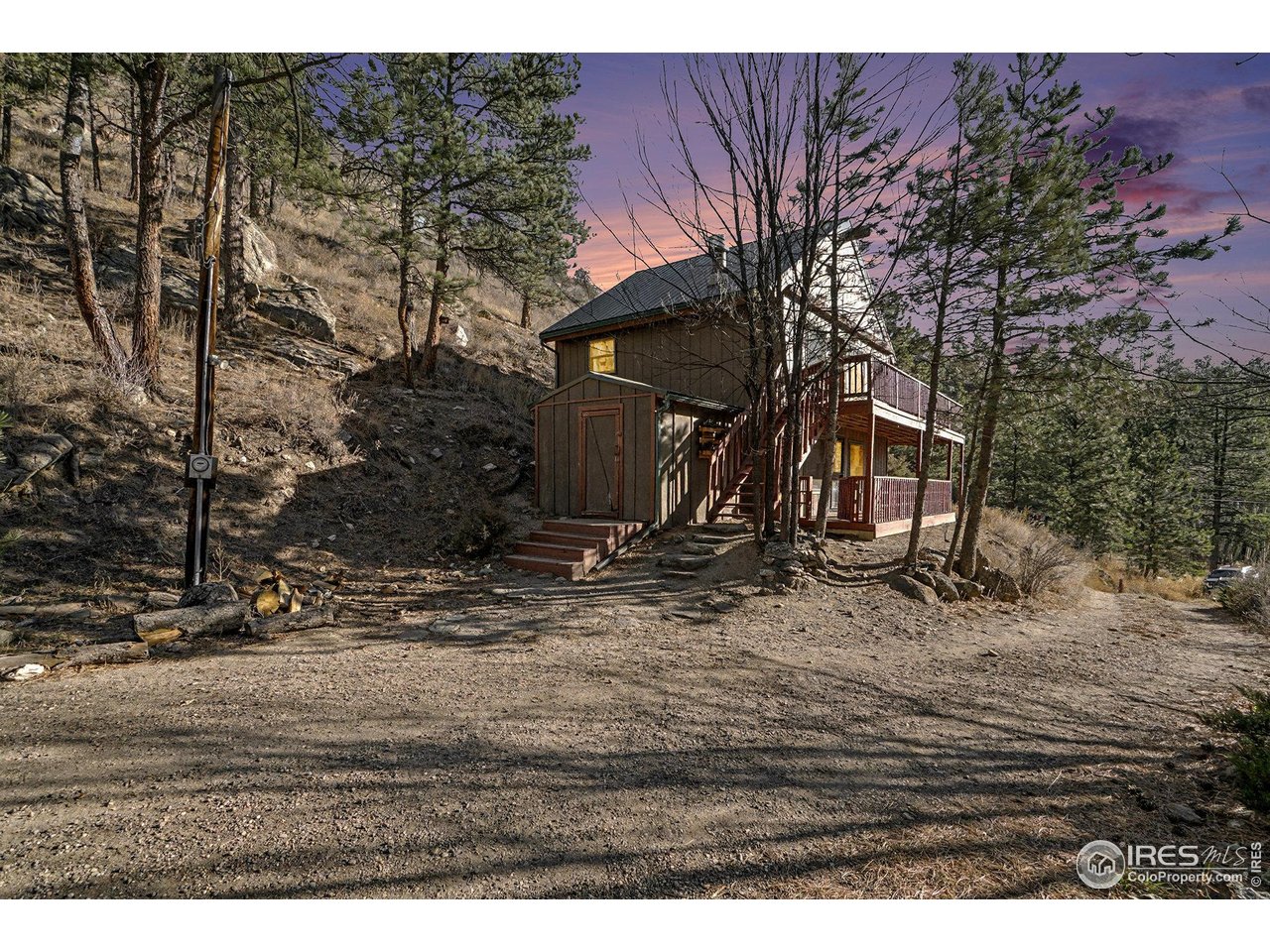 Classic Colorado mountain cabin on 2.16 private acres between Estes Park and Loveland, just off Highway 43 and near National Forest access. This well-maintained retreat offers 2 bedrooms plus a loft, 2 full baths, warm wood ceilings, and a cozy wood-burning fireplace. Recently refinished wraparound deck and lower-level deck create great outdoor living space with frequent wildlife sightings in a peaceful mountain setting. Built in 1977, the home includes electric baseboard heat, metal roof, newer washer and dryer, private well with strong GPM, septic vault system, and 4' x 6' storage shed. Sellers may be open to including most furnishings, offering turn-key potential for a full-time home, weekend getaway, or investment property.