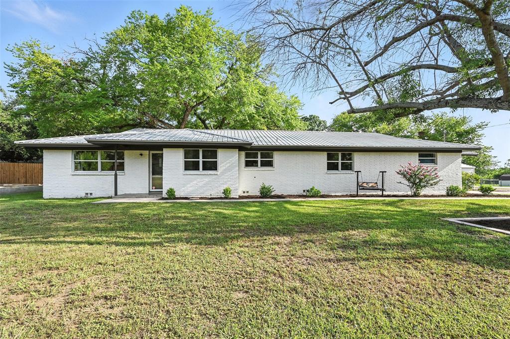 This beautifully remodeled Aledo home blends stylish design with a smart, functional layout. Light oak flooring and bright interiors are accented by rich, moody green cabinetry and trim for a modern yet inviting feel. The heart of the home features an updated kitchen with quartz countertops, new appliances, and a stunning backsplash, flanked by two spacious living areas perfect for entertaining or relaxing. Step outside to a backyard designed for fun and gatherings—complete with a diving pool, sports court, and mature shade trees. The home features a durable metal roof, attached two-car garage, detached two-car carport, extended driveway, and gated access to a rear barn provide exceptional utility for hobbyists or tradespeople. Covered parking for four vehicles and plenty of room to grow—this property has it all and will move quick.  Schedule a showing today!