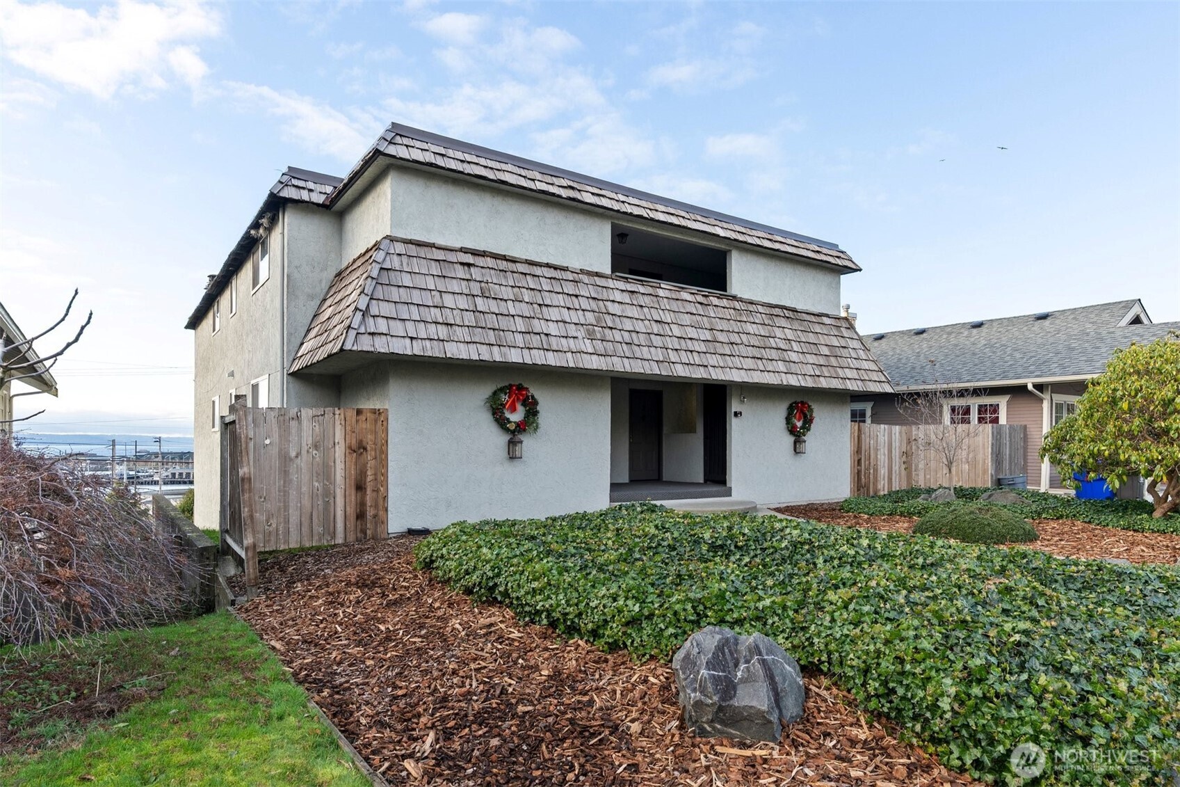 Positive cash flow 4-Plex with stunning panoramic sound and mountain views! Incredible investment property with owner occupied opportunity! Meticulously maintained building with 2 bed, 1 bath, 960sf units with large balconies, secure garage parking, storage, and just moments to the Everett waterfront and the heart of downtown. Each unit enjoys the sweeping views of the Puget Sound and Olympic Mountains! One unit fully updated recently and others have varying levels of upgrades. All units have newer water heaters, newly installed waterproof coating on balconies, 1 car parking in garage, individual storage unit, and a fireplace. One unit intentionally vacant for owner occupied purchase opportunity; however, will lease very quickly. Long term tenants, all month to month with opportunity for immediate rental increases, and one owner for last 34 years. Spacious laundry room on site with leased washer/dryer, garage doors brand new last year, newer exterior flooring, and well cared for flat roof and stucco siding. Gated pedestrian access to lower level garage, storage, and laundry. Lower level also includes two large building owner storage rooms. Sought after Grand Avenue location and neighborhood with easy access to newly developed waterfront amenities and activities, minutes to downtown Everett, and easy access to freeways. This is the perfect time to acquire a multi-family investment within the amazing growth of Everett and Snohomish County. These views are a rare find!