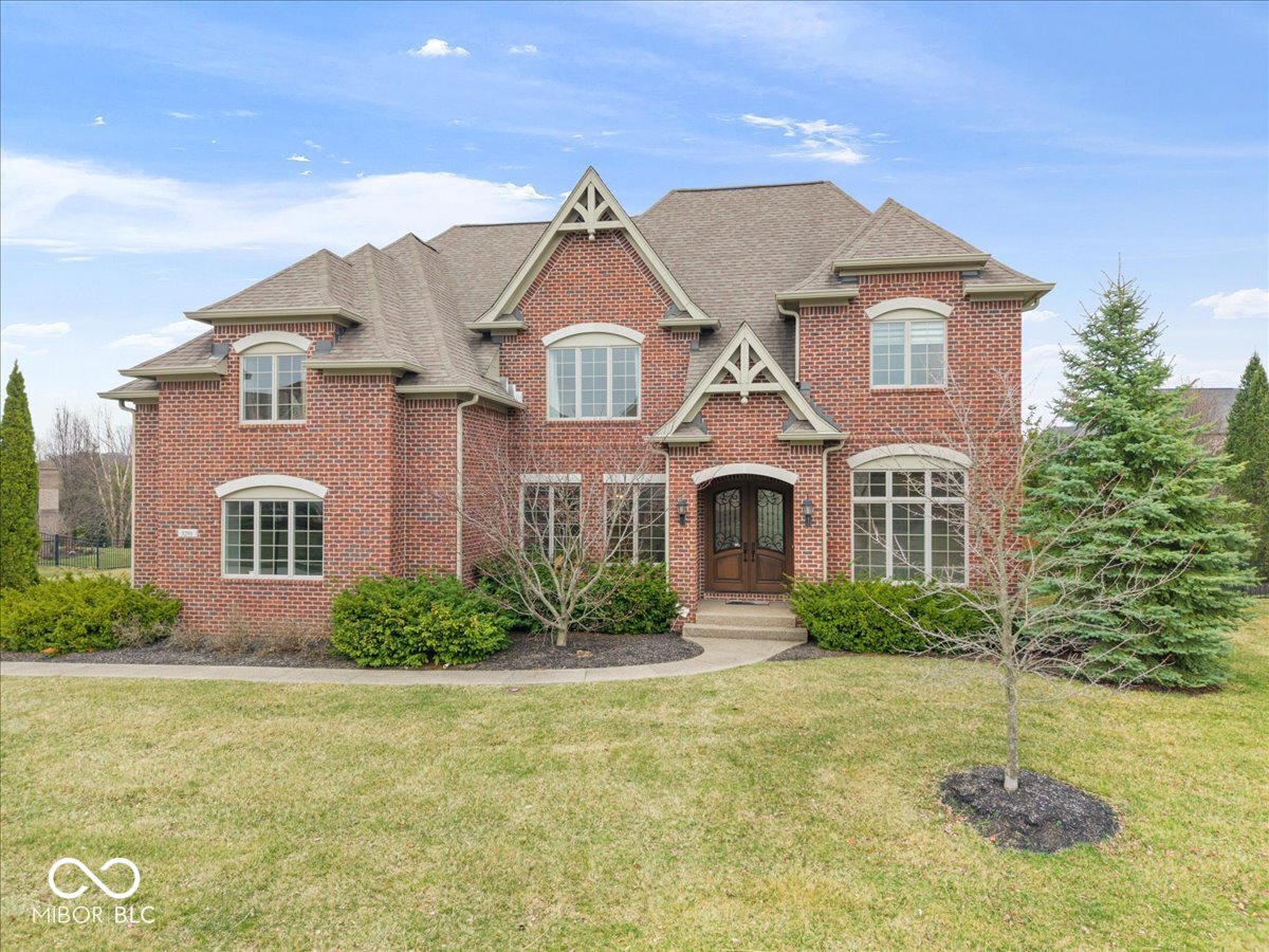 Beautifully updated home in highly sought-after Saddlebrook at Shelborne in West Carmel. Filled with natural sunlight, this spacious residence offers 6 bedrooms and two main-floor offices, one featuring custom built-ins. The open-concept main level showcases gleaming hardwood floors, fresh interior paint, and new carpeting on the upper level. The large family room flows into a well-appointed kitchen featuring a Bertazzoni oven and range, Bosch appliances, and a brand-new refrigerator, dishwasher, and microwave, creating an ideal space for both everyday living and entertaining.   Upstairs, the expansive primary suite offers a luxurious retreat with a walk-in shower and generous closet space, while the additional bedrooms are impressively sized. The finished lower level is designed for entertaining, complete with a wet bar featuring rich wood built-ins and a theater area. Step outside to a large backyard with a patio and fire pit, perfect for relaxing evenings or hosting friends. This home offers the space, updates, and lifestyle today's buyers are looking for - all in one of West Carmel's most desirable communities.