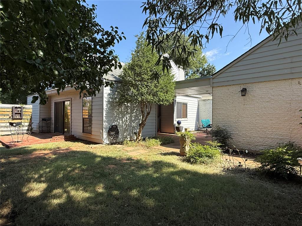 Welcome to this charming 3-bedroom, 2-bath home with 1,647 sq. ft. in the highly sought-after Putnam City School District! Step inside and discover a warm and inviting layout. The primary suite is tucked away upstairs for extra privacy, complete with its own bathroom and a bright loft space with skylights — the perfect spot for a home office, cozy reading nook, or creative space. Downstairs, you’ll find two additional bedrooms and a full bath, offering flexibility for family or guests. The home features a 2-car garage and a private, fenced-in courtyard that feels like your own retreat. Gardening enthusiasts will love the tomato garden, iris-lined fence, and lush landscaping throughout the property. Conveniently located less than 5 minutes from the turnpike, this home offers easy access to shopping, dining, grocery stores, and the mall — everything you need just around the corner. Don’t miss your chance to own this private, cozy space in a prime location! Schedule your showing today!!