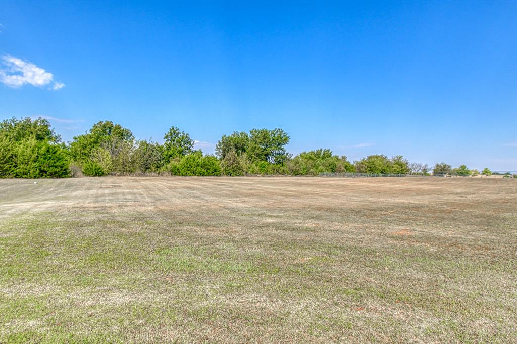 Say hello to a unique opportunity to build your dream home on a 2.46-acre lot in gated Wellington Lake in East Norman. This picturesque lot sits at the end of a cul de sac and offers the flexibility to choose your builder, allowing you to create a home that perfectly reflects your vision.  The community maintains aesthetic beauty and value through established guidelines, including a minimum home size of 1,750 square feet. Additionally, the construction of a shop building is permitted, subject to approval from the design review committee to ensure it aligns with community standards.  One of the key advantages of this lot is its construction readiness, as electricity is already on-site. Please note that a well has not yet been drilled, and septic facilities are not yet installed.  This lot offers a future filled with possibilities, seize this opportunity to turn your architectural aspirations into reality!