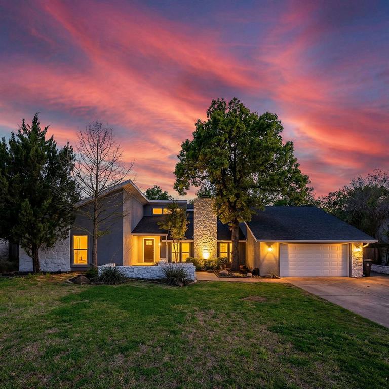 Architectural drama and effortless livability come together in this remarkable Quail Creek residence, offering a rare blend of scale, style, and everyday comfort in one of Oklahoma City’s most established communities, just minutes from the Kilpatrick Turnpike, Quail Creek Golf & Country Club, and premier shopping and dining. Vaulted ceilings and expansive skylights pour natural light across stone and concrete flooring, while two striking stone fireplaces, including a double-sided feature, create a bold focal point for both entertaining and relaxing. Multiple living and dining areas flow seamlessly alongside crisp white trim, custom built-ins, and an updated kitchen designed for modern living, complete with a wet bar, breakfast bar, enclosed porch for year-round enjoyment, and a discreet pocket office. The primary retreat delivers a spa-inspired bath with a generous shower and refined layout, while an upstairs bonus space adapts easily into a media room, fitness zone, or creative studio. Outdoors, mature trees frame a private backyard with a stone patio and firepit, plus bonus space above the garage for added flexibility. Dont miss out on the architectural presence, versatile living spaces, and coveted Quail Creek setting—experience this Oklahoma City home firsthand and discover how seamlessly it fits both quiet evenings and vibrant gatherings.