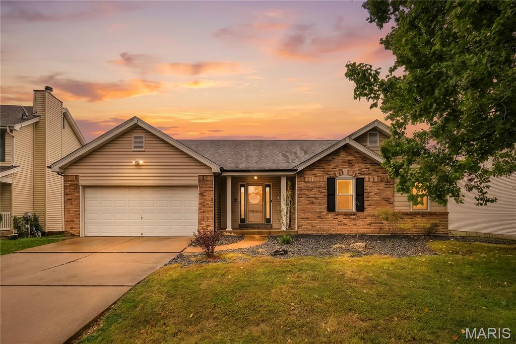 This updated ranch on a quiet cul-de-sac in Stone Ridge Estates is move-in ready. Three bedrooms and two full baths on the main floor, the finished lower level gives you room to spread out, and the big projects are already done. New roof, newer windows, newer flooring, and a kitchen that will make you want to cook. Step through the front door as the living room opens up with a vaulted ceiling, the skylights pour in natural light, and a gas fireplace with a fresh new surround and hearth makes a cozy space. The living room flows right into the dining area and kitchen, making the open floor plan work as one big gathering spot for game nights, holidays, and everyday dinners. The kitchen is the highlight of the house, with solid-surface countertops, crisp white cabinets, and a subway tile backsplash that runs all the way to the ceiling, and modern pendant lights hang over a peninsula, setting the tone. There's a pantry, stainless appliances, and a sliding door off the dining area that leads straight out to the deck. The garage door is right off the kitchen, making unloading groceries quick and easy. The bedrooms are tucked away on their own side of the house, giving everyone a little space from the living area. The primary bedroom has a walk-in closet and its own full bath, and the two additional bedrooms share the hall bath. Head downstairs and you'll find a lower level that's open and ready to use. The open ceilings, new lighting, and flooring make the whole space finished. The huge recreation room fits a sectional, a big TV, and a play area all at once. A bonus room off the rec room is ready to be your home office, gym, or guest space. A half bath and separate unfinished room that has plenty of room for storage. Out back, the deck overlooks a level yard surrounded by a white vinyl privacy fence, so the backyard is all yours. The landscaping and in-ground sprinklers keep everything looking sharp with less effort. Stone Ridge Estates amenities include a clubhouse, pool, tennis courts, and common ground. The home is in the Francis Howell School District, and Highway 94/364 is just minutes away. The big-ticket updates are already checked off. Come see it for yourself. Schedule your showing today!