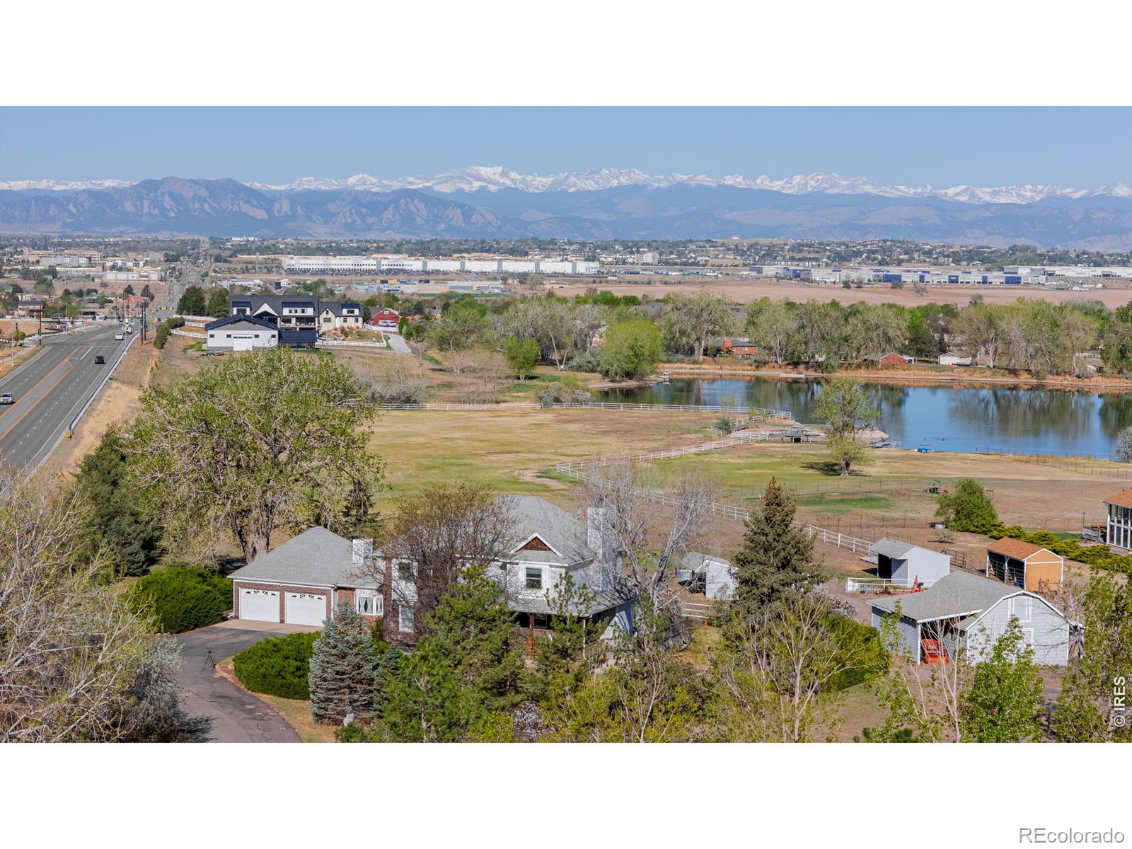 Enjoy the best of both worlds, a beautiful rural setting with the close proximity to the city amenities and Front Range of Colorado. This sprawling nearly 7 acre Lake Front property boasts a beautiful 4 bedroom 4 bath home with stunning custom finishes. Entertain guests in your large eat-in kitchen and sitting area or gather for special occasions in the formal dining room. Choose to relax in one of the 3 living/family rooms all with its own fireplace, and a central vacuum system makes cleaning up simple. Take in the world class mountain views from your private pool area, the covered porch, the enclosed patio or the private dock and fire pit area on the lake. Horse lovers will take advantage of the large partially fenced pasture, the barn with stall and hay storage along with ample room for added improvements. This unincorporated Adams County Estate provides water for gardens, animals, lawns and the incredible landscaping via a pumping system from 3 nearby reservoirs provided through the HOA. When the days get hot and the sun is high enjoy the large above ground pool with a custom deck built 360 degrees around it, cook lunch in your outdoor BBQ area or enjoy the shade of the large mature trees or the covered patio. Don't forget the Rocky Mountains and all they have to offer! This property is an hour +/- from world class ski resorts, Rocky Mountain National Park, fishing, white water rafting, hunting of all types or just a relaxing drive through some of the most beautiful scenery in the world. Please don't miss out on this incredible opportunity to own this "one of a kind" property.