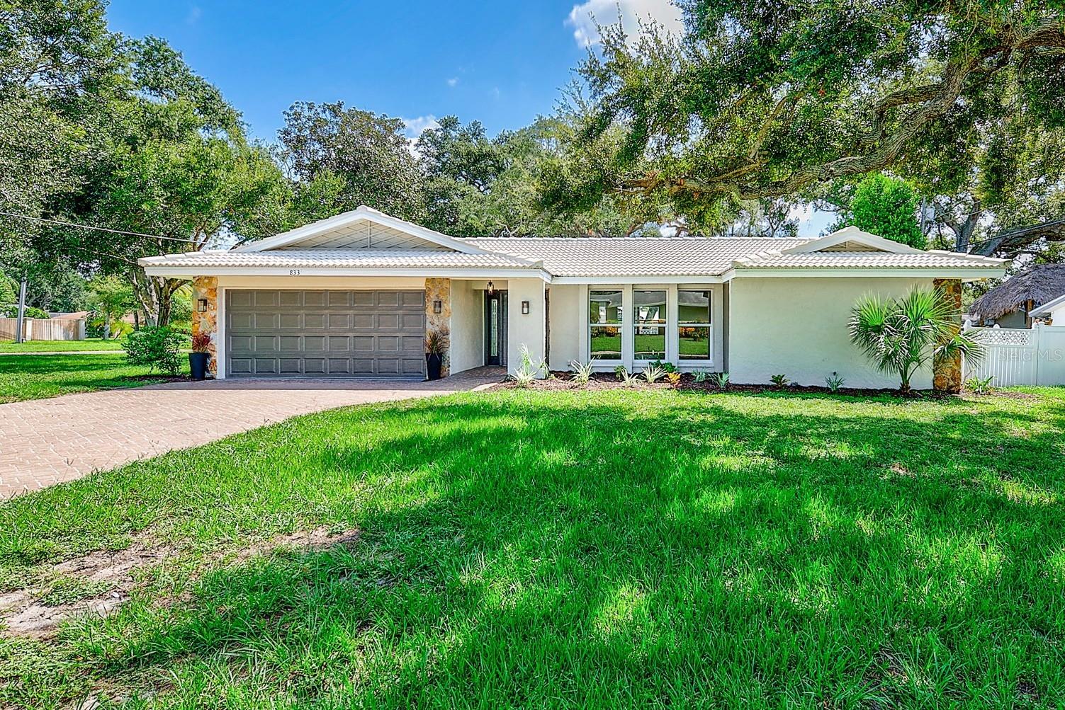 Location, location, location! Welcome home to this beautifully updated 3-bedroom, 2.5-bath residence in the heart of Largo, offering a spacious split-bedroom floor plan designed for both everyday living and entertaining. From the moment you step inside, you’ll appreciate the fresh, cohesive feel of luxury vinyl flooring flowing throughout the home, creating a clean and inviting backdrop for any style.The updated kitchen is both functional and welcoming, featuring modern finishes and an eat-in bar that opens to the living space, making it easy to stay connected while preparing meals or entertaining guests. The home also offers two updated bathrooms and an updated half bath for guests, providing a fresh, move-in-ready feel throughout. An indoor laundry room adds valuable convenience and keeps laundry tucked away from the main living areas. Step outside to the screened-in porch, the perfect place to enjoy your morning coffee, unwind after a long day, or take advantage of Florida’s beautiful year-round weather. A paver driveway enhances the curb appeal and provides a welcoming entrance to the home. And then there’s the location! Conveniently situated near shopping, dining, parks, schools, major roadways, and the beautiful Gulf beaches, this home puts you close to everything you need while still offering a comfortable place to call home. Updated, functional, and ideally located, this Largo home is one you won’t want to miss!