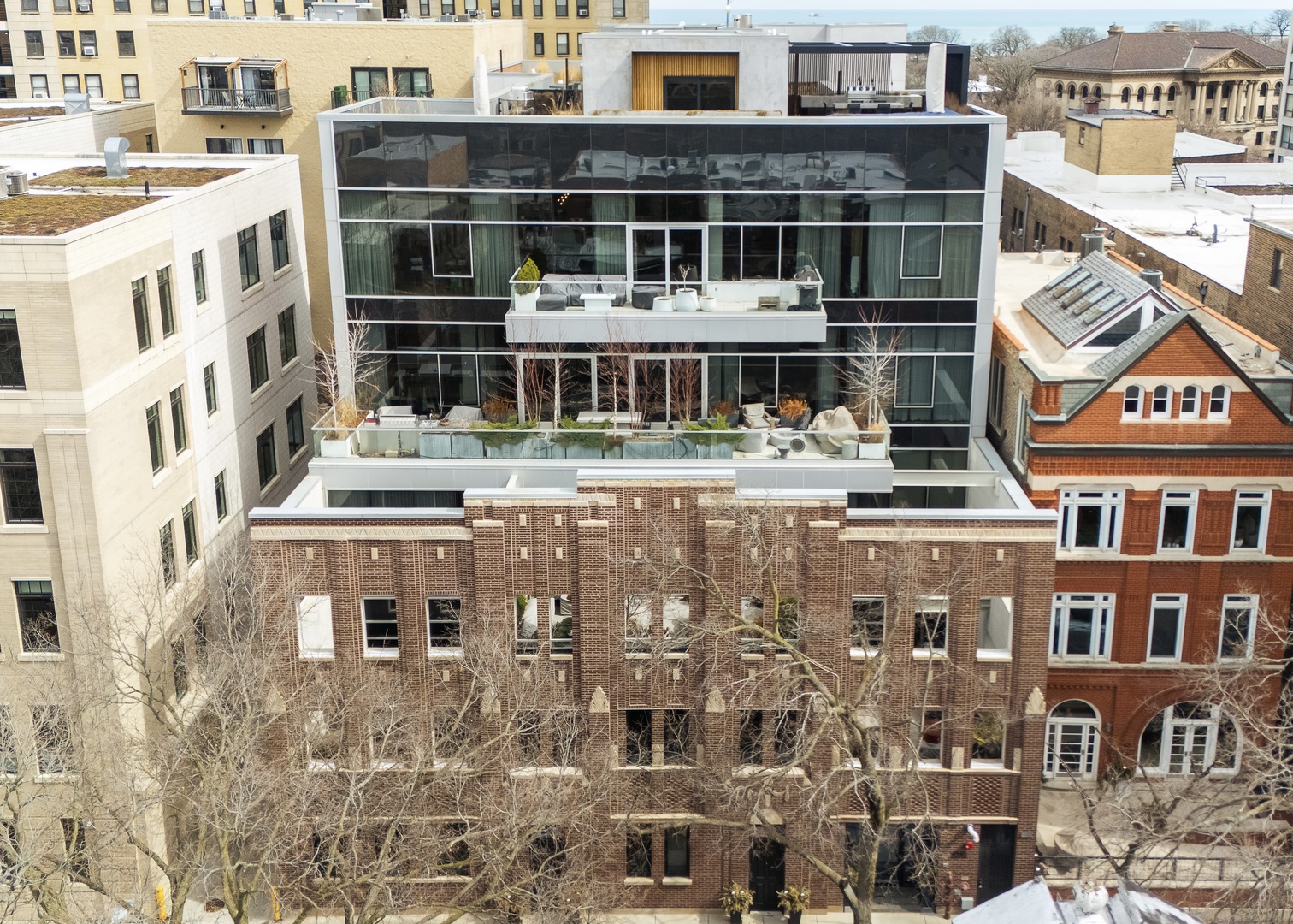 Experience an extraordinary level of design and craftsmanship in this sophisticated 3 bedroom, 3.5 bathroom residence, perfectly situated in a sought-after East Lincoln Park location. Nestled within an exclusive 10-unit boutique building, this home offers an expansive, light-filled layout with floor-to-ceiling windows and seamless indoor-outdoor living. Every detail has been elevated, beginning with the state-of-the-art Control4 Smart Home System, integrating lighting, sound, and climate control at the touch of a button. At the heart of the home is the exceptional Ernestomeda kitchen, a stunning combination of sleek Italian cabinetry  and top-of-the-line appliances. Designed for both entertaining and everyday functionality, this chef's kitchen includes a SubZero refrigerator and freezer, an upgraded Wolf cooktop, an additional Wolf steam oven, and oversized island. Thoughtfully placed hidden appliance nooks create a streamlined aesthetic. The sprawling living and dining areas flow effortlessly onto an expansive private terrace, designed for entertaining with custom pavers and a fireplace gas line - an urban oasis just steps from the park. A striking custom-designed fireplace and architectural surround create a dramatic focal point in the main living space, adding warmth and sophistication. The primary suite is a sanctuary of luxury, featuring a custom Poliform closet and a spa-inspired ensuite bathroom. Designed for ultimate relaxation, the bath showcases Antonio Lupi sinks, heated floors, Toto toilet, an oversized walk-in shower, and a freestanding soaking tub, creating the perfect space to unwind. Both additional bedrooms are designed for comfort and privacy, each featuring custom walk-in closets and ensuite spa-quality bathrooms. A well-appointed powder room adds extra convenience for guests. Throughout the home, Rimadesio glass frameless doors enhance the sleek, contemporary aesthetic. Additional highlights include custom drapery throughout, upgraded designer wallpaper and lighting, a spacious laundry room, and an 8x10 climate-controlled storage unit. Two heated garage parking spaces with Tesla chargers complete this remarkable offering. Set on a quiet, tree-lined street, this location is truly unbeatable-just steps from Lincoln Park, the lakefront, world-class dining, shopping, top-rated schools and renowned Farmer's Market. With a perfect blend of privacy, sophistication, and modern innovation, this residence is a rare opportunity to own a home that redefines luxury city living!