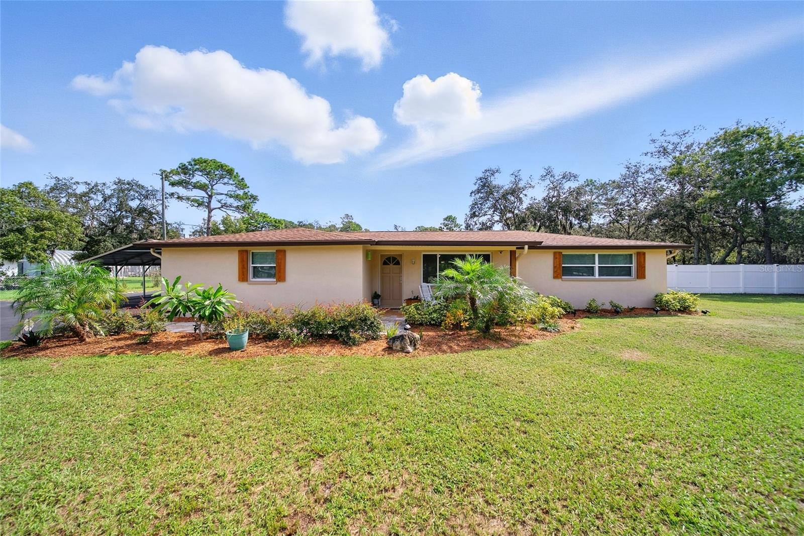 MUST SEE!!!  NO HOA OR CDD!!  1.77 ACRES!!  This home is LOADED WITH UPGRADES AND PERSONAL TOUCHES and even an Enclosed Swim SPA!!! Looking for a large 4-bedroom home on ACREAGE??  You can get it all with this home: acreage, detached 2 car garage with A/C, 31 x 18 workshop, 22X21 car port, 8x12 storage shed, covered outdoor kitchen area, new partial privacy fence, fenced in yard, water treatment system, new asphalt driveway, outdoor Shower and Sink, pavers and neatly designed walkway, fire pit, gutters, and your own personal outdoor stage for entertainment and parties!!  You can even have up to 3 grazing livestock on this property!! This home is ready to go, turnkey with lots of new features.  There will be nothing holding you back from this one, home is like new and has been completely updated!! Located in the desirable Tanglewood East neighborhood, which is close to schools, PHS college west, shopping, restaurants, and easy commute to Tampa or the beaches.  Put this on your list to see and let's make a deal!