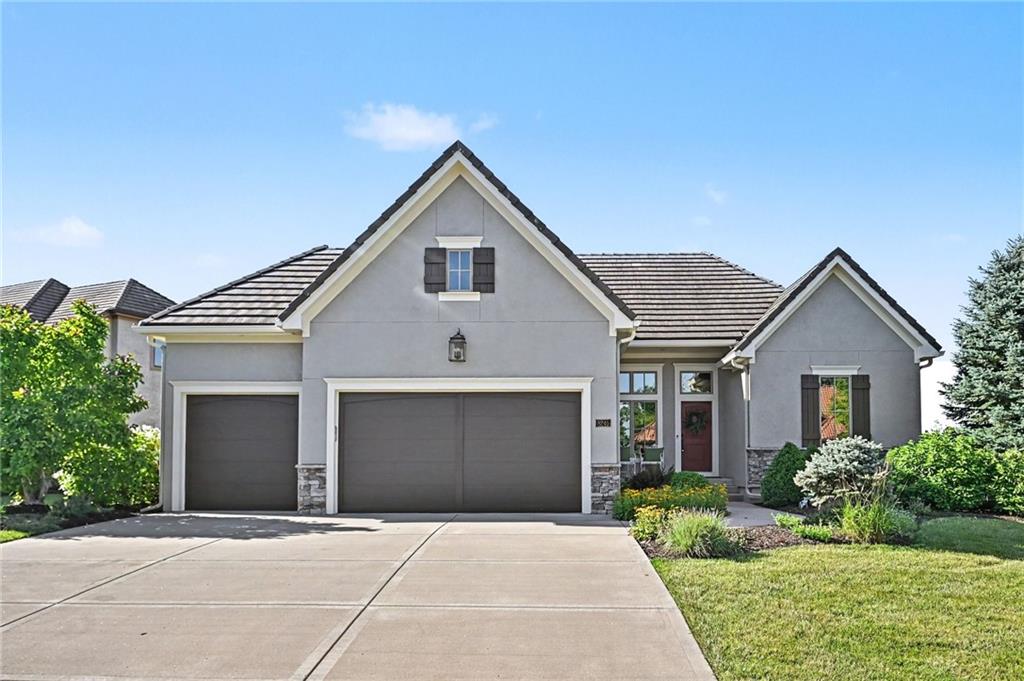 Rare opportunity to own a beautifully appointed home in the highly sought-after Riss Lake Reserve. Enjoy maintenance-provided living, including lawn care and snow removal, while taking advantage of the exceptional amenities offered within the Riss Lake community. Residents enjoy access to a private lake with docks, three swimming pools, tennis and pickleball courts, basketball courts, walking trails, and a children’s play area. Built by renowned Don Julian Builders, this stunning Overland II floor plan offers 4 bedrooms, 2.5 baths, and an elegant reverse 1.5-story design. Upon entry, you are welcomed by a spacious foyer with open sightlines leading into the great room featuring a fireplace, a beautifully designed kitchen, and an adjoining dining area—perfect for both everyday living and entertaining. The main level also features a spacious walk-in pantry, laundry room, and a convenient office space. Step outside to the covered deck overlooking lush landscaping, creating a peaceful outdoor retreat. The luxurious primary suite on the main level includes a generous walk-in closet and spa-inspired en-suite bath complete with dual vanities, a jacuzzi tub, and a walk-in shower. The lower level offers three additional bedrooms, a full bath, a large recreation room, and abundant storage space, providing flexibility and comfort for family and guests alike.