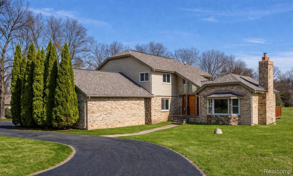 Meticulously maintained 4-bedroom, 2.5-bath home on 5 beautiful acres in Brandon Township just outside of Ortonville, showcasing true pride of homeownership. This move-in ready property has been thoughtfully updated throughout with countless major improvements, including a new furnace (4 months with transferable warranty), roof (6 years with 20 year transferable warranty), kitchen (5 years), full bathroom (1 year), air conditioner (5 years), tankless hot water heater (2 years), basement waterproofing with transferable warranty (2 years), washer and dryer (3 years), new shed (3 years), fence (2 years), and updated gas and electric fireplaces (2 years).The home also features a whole-house Generac generator, a walkout basement (that has been plumbed for a bathroom), and a large wood deck overlooking the property — perfect for enjoying peaceful country views. Beautiful hardwood floors run throughout the main level, and the owner has planted over 50 pine trees along the perimeter, creating privacy and a picturesque setting. Located within walking distance to Cook’s Dairy Farm, this property offers the perfect blend of country living with modern updates. All the work has been done — just move right in! BATVAI