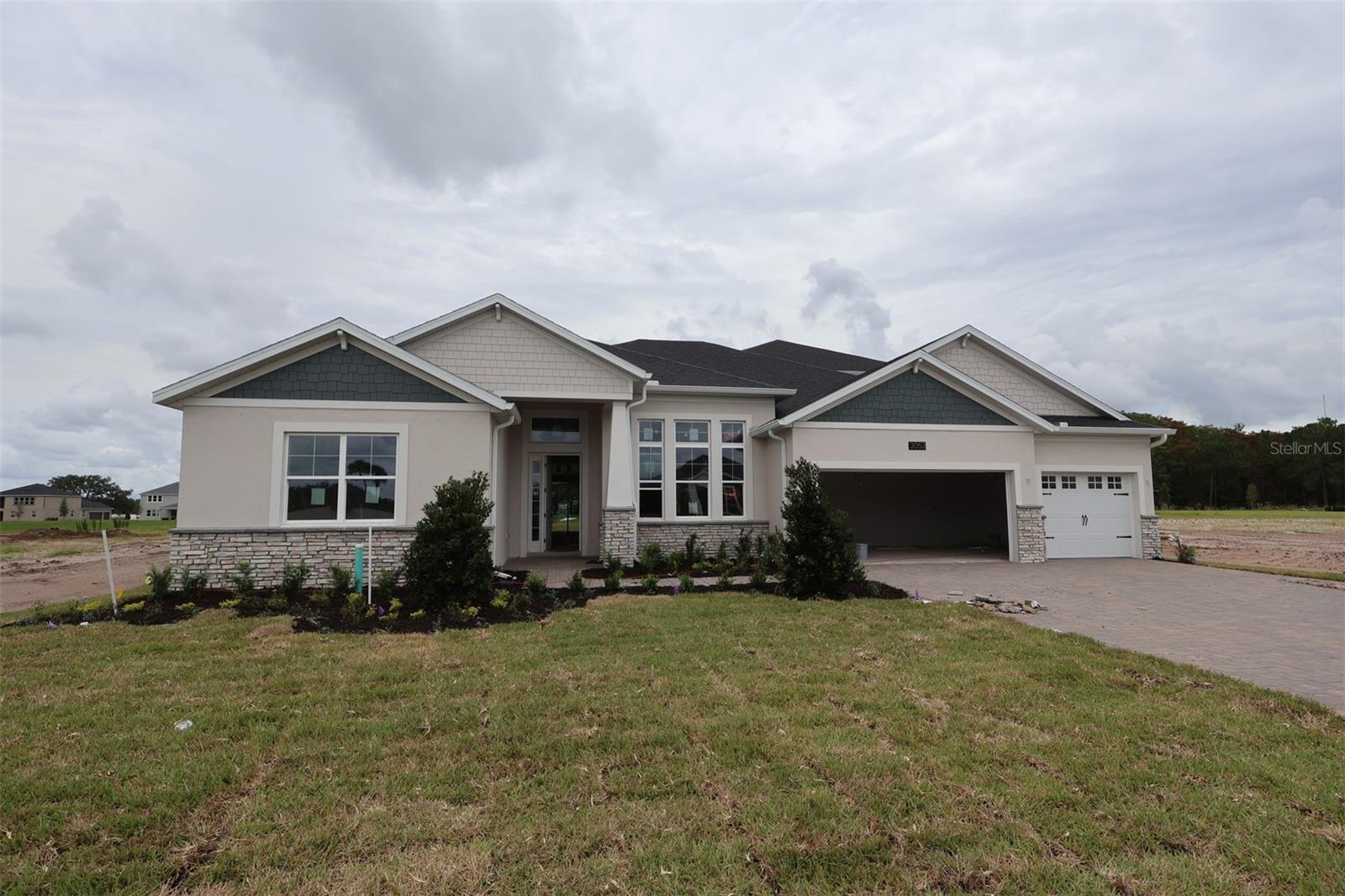 Under Construction. Discover this stunning new construction home at 3053 Solace Way Orlando, built by M/I Homes. This impressive 5-bedroom, 4.5-bathroom home spans 4,530 square feet and features thoughtfully designed living spaces perfect for modern family life.The home showcases quality design elements throughout, with attention to detail evident in every room. The open-concept floorplan creates seamless flow between living areas, while the generous square footage provides ample space for comfortable living and entertaining.The kitchen is sure to impress with its 42-inch cabinets, oversized island, walk-in pantry, and separate breakfast area with panoramic views of the backyard. The family room and extended rear lanai are showstoppers as well.The main living areas separate the bedrooms—all of which have walk-in closets—for extra privacy. Your owner's suite features a tray ceiling, a spa-inspired en-suite bathroom, and two walk-in closets.A massive bonus room with hardwood floors, as well as a bedroom and full bath, are on the second floor to provide you with even more space and flexibility for family and guests. This new construction home is an exceptional opportunity to own a beautifully designed residence in one of Orlando's sought-after neighborhoods. Contact us today for more details!