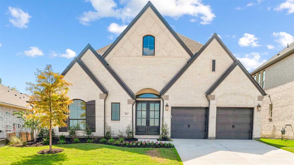 MOVE-IN READY! Home office with French doors frames the entry. Guest suite with a walk-in closet and a full bath. Theatre room with French doors. Kitchen features a large pantry, 5-burner gas cooktop and a large island with built-in seating space. Family room with a wood mantel fireplace and wall of windows. Primary suite with 12-foot coffered ceilings. Double doors lead to primary bath with separate vanities, a freestanding tub, separate glass-enclosed shower, and two walk-in closets. Covered backyard patio. Mud room leads to three-car garage.