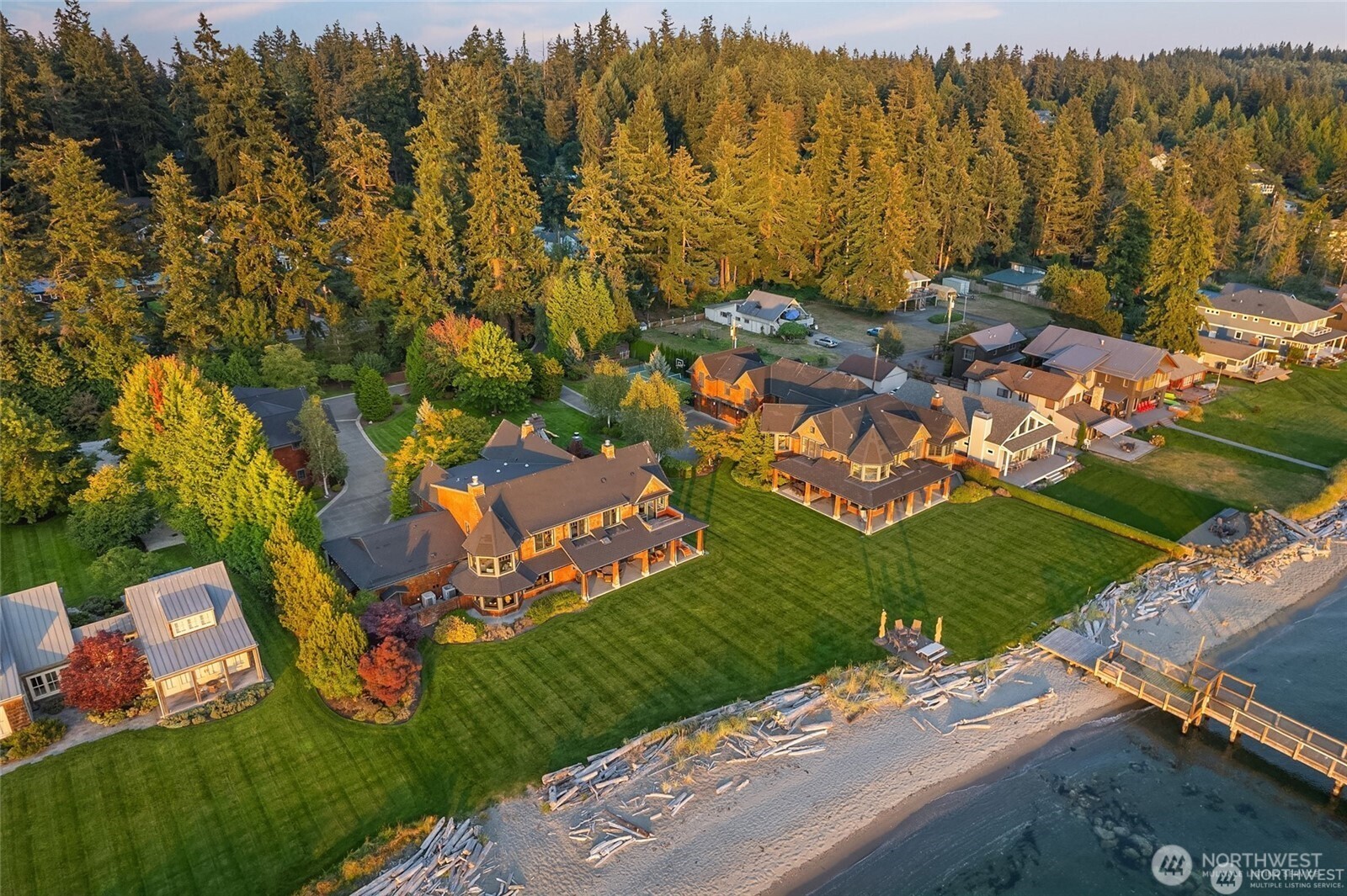 Unrivaled waterfront luxury on Whidbey Islands coveted Mutiny Bay. This gated 1.6 acre estate offers 214' of pristine no bank sandy beachfront with sweeping views of Puget Sound and the Olympic mountains. The private compound includes sophisticated main residence, elegant guest house, and a beautifully appointed carriage house. Impeccable landscaping, expansive entertaining, a shared 400' plus dock for boats, water craft and float plane creates the ultimate retreat. A rare opportunity to own one of the Pacific Northwest finest coastal Estates.