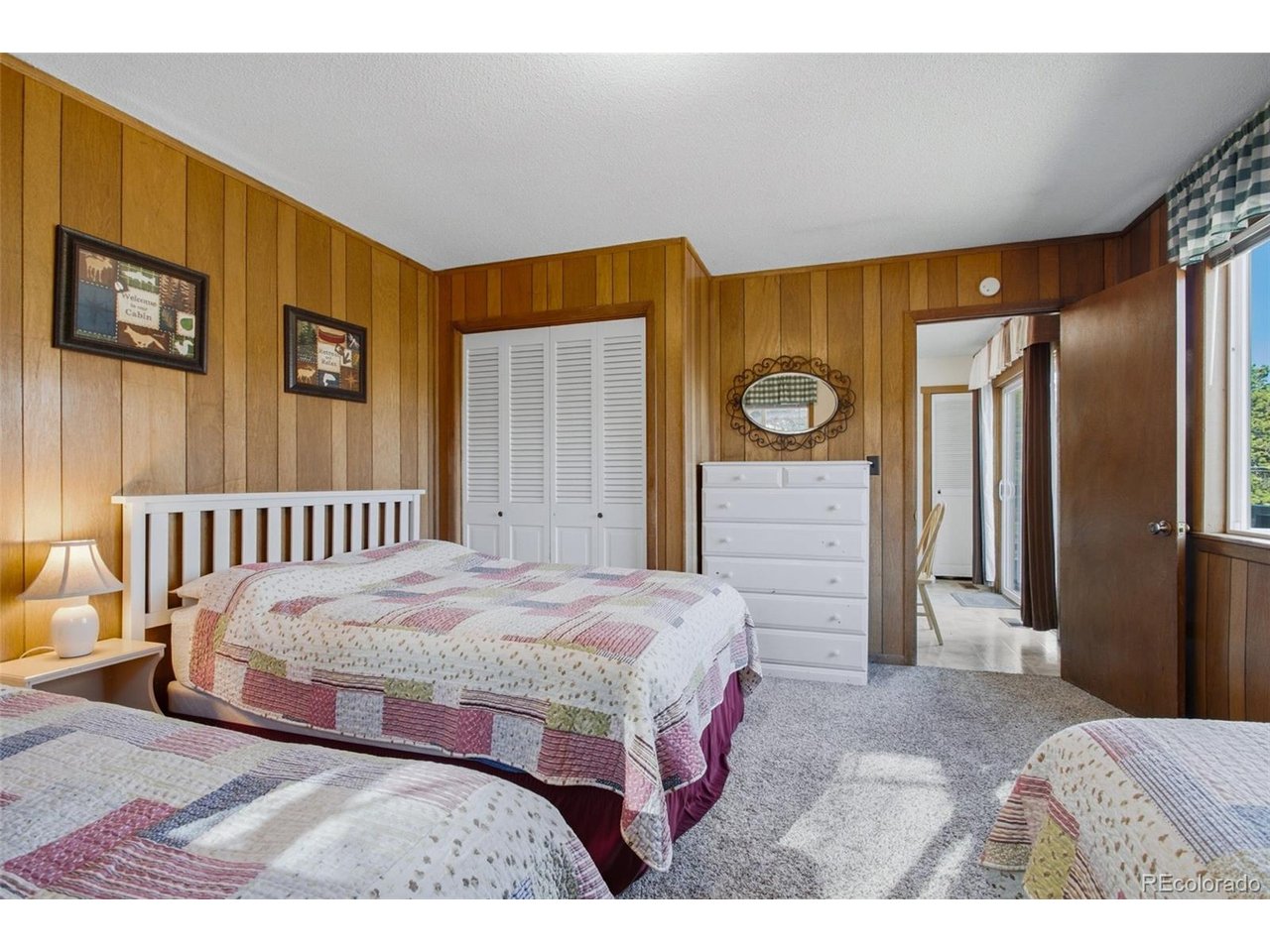 Introducing 27 Freya Lane in the coveted Valhalla Resort Condominiums - offered for the first time in 55 years and set on beautifully forested grounds bordering Rocky Mountain National Park. This rare mountain retreat places you steps from hiking trails, wildlife sightings, and the quiet beauty of nature right outside your door. The classic cottage offers 857 square feet of inviting living space, featuring two bedrooms, one full bath, and an open kitchen and living area anchored by a striking native sandstone fireplace. A sliding glass door opens to a private deck overlooking a peaceful meadow with views toward Eagle Cliff, creating the perfect setting for morning coffee or evenings under the stars.Enjoy the sights and sounds of nature, stroll directly into RMNP on marked trails, or simply relax and watch elk and deer wander through the property. Just a couple of miles from the YMCA of the Rockies and less than two miles from the Beaver Meadows entrance, this location blends seclusion with convenience and year-round recreation including hiking, climbing, and wildlife viewing.This cozy, fully furnished cabin is move-in ready, making it ideal as a personal retreat or legacy property to enjoy for generations.Additional notes:No short-term rental ("STR") license currently in place. Buyers considering STR use should verify requirements with Larimer County, including potential road improvement requirements on Eagle Cliff Road. Property is located outside the Town of Estes Park. Buyer or buyer's agent to verify all measurements.Danette Barrett is a Colorado-licensed real estate broker and also a principal of Seller.