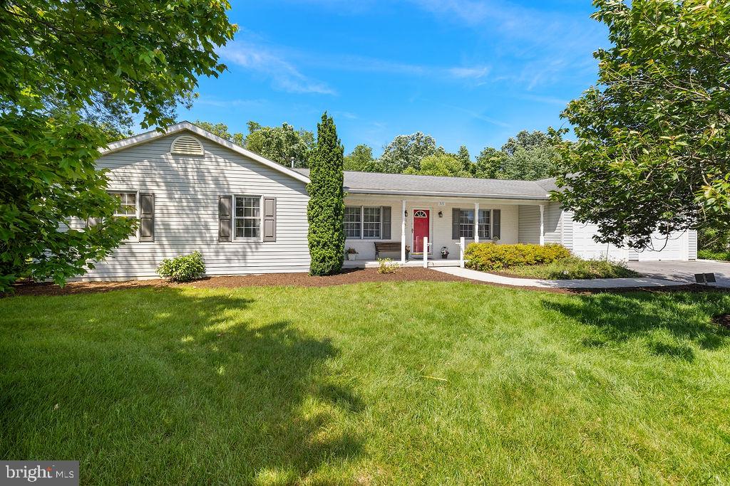 Come see this beautiful home near  Gettysburg PA — a well-maintained 3-bedroom, 2.5-bath rancher offering comfortable one-level living in a mature and peaceful setting close to town. This home features a spacious and functional layout with laundry conveniently located on the main level and an abundance of kitchen cabinet storage for all your cooking and organizational needs.The home includes upgraded interior doors, adding a quality touch throughout, along with a large garage featuring an additional workshop area perfect for hobbies, storage, or projects. A partial basement provides even more space and flexibility.One of the standout features is the impressive 32’ x 12’ all-season room complete with a cozy gas fireplace — an ideal space to relax year-round while enjoying views of the backyard and adjoining woods. Step outside to the 12’ x 12’ deck, perfect for entertaining or quiet evenings outdoors.Located just minutes from historic Gettysburg, this property offers the convenience of nearby shopping, dining, and commuter routes while maintaining a private, wooded backdrop. Minimal HOA dues add to the appeal of this wonderful home.**Professional pictures expected Sunday