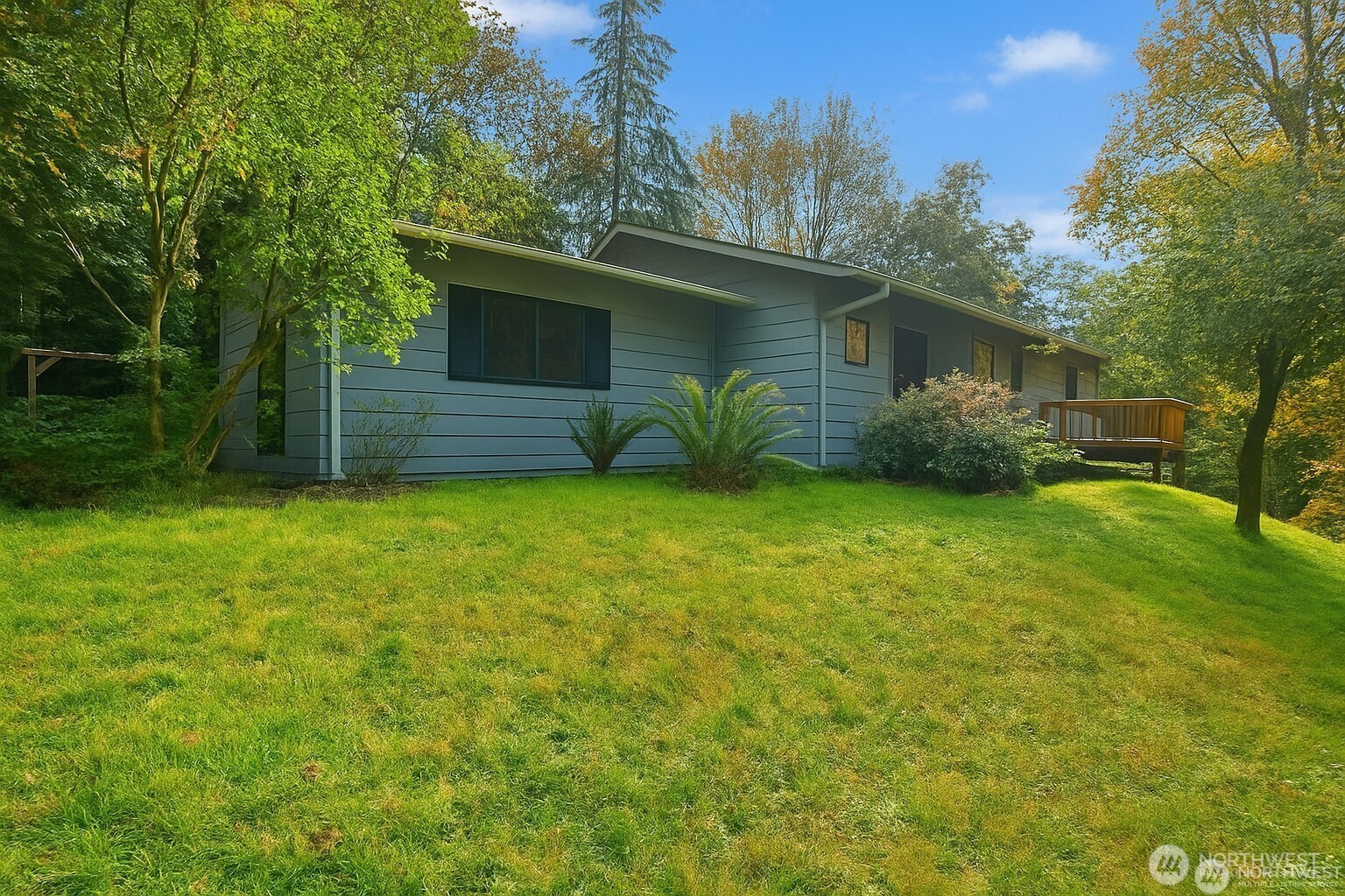 Spacious 4-bedroom, 3-bath home ideal for multi-generational living, guests, or rental income potential. The lower level offers a private suite with its own entrance, living room, bedroom, kitchenette, laundry, and bath. Tucked at the end of a quiet dead-end road in a beautiful mountain valley, enjoy peaceful walks, biking, and abundant nature. Perfectly located between Mt. Rainier and Mt. St. Helens, this area is a paradise for hikers, fishers, and hunters. The yard features a garden and mature blueberry bushes. Adjacent 11.5 forested acres also available.