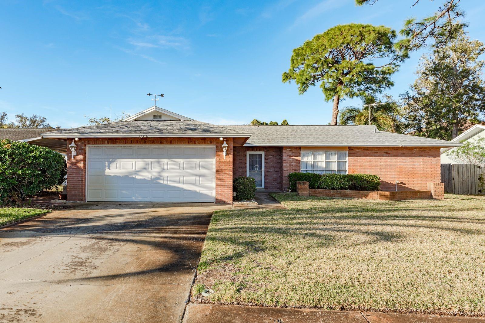 This lovely home is ready for its next owner!  With a split floorplan and spacious bedrooms, this home is ideal! Plenty of living space!! The combination living and dining room plus eat-in kitchen AND family room make it ideal for a family or those who like to entertain.  The primary bedroom has an en-suite and walk-in closet. Enjoy your spacious back yard from the large screened-in patio. The two-car garage plus large driveway provides plenty of parking for friends and family. NO HOA!!!!  Located in the historic town of Tarpon Springs, this home is walking distance to Sunset Beach where you can enjoy a day at the beach, movie nights, evening concerts or a cookout at one of the pavilions. Walking distance to the nearby schools. This home has been lovingly maintained by its owner so don't miss out on an opportunity to make this solid block home yours today! Newer HVAC and 2016 roof.