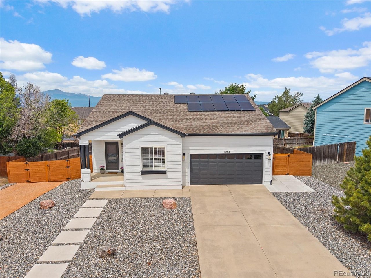 Welcome home to this beautifully maintained ranch style retreat where comfort, convenience, and thoughtful upgrades come together. From the moment you arrive, you'll appreciate the stunning curb appeal created by the low maintenance xeriscaped front yard, attractive fencing, and dedicated RV parking. Inside, soaring vaulted ceilings with exposed beams and a cozy gas burning fireplace create a warm and inviting atmosphere. Luxury vinyl plank flooring flows throughout the main living areas, while custom plantation shutters add timeless style and privacy throughout the home. Just off the entry, French doors open to a private office, offering the perfect space for working from home, managing daily tasks, or enjoying your favorite hobbies. The well appointed kitchen features stainless steel appliances, a large pantry, ample workspace, and easy access to outdoor living. Step outside to the expansive covered patio where privacy shades create a comfortable setting for entertaining, outdoor dining, or simply unwinding after a long day. The backyard is designed for enjoyment and functionality, complete with a sprinkler system, storage shed, and a built in doggie door with an exterior ramp for your four legged family members. The home offers three comfortable bedrooms and two updated bathrooms. The primary suite provides a peaceful retreat with a spacious walk in closet and a beautifully remodeled bathroom featuring a large walk in tile shower. Additional upgrades include a whole house water filtration system, fresh interior doors, epoxy coated garage flooring, and numerous features that enhance both everyday living and long term value. Whether you're hosting friends on the patio, enjoying a quiet evening by the fire, or taking advantage of the RV parking and extra storage, this move in ready home offers a lifestyle that's as practical as it is inviting!