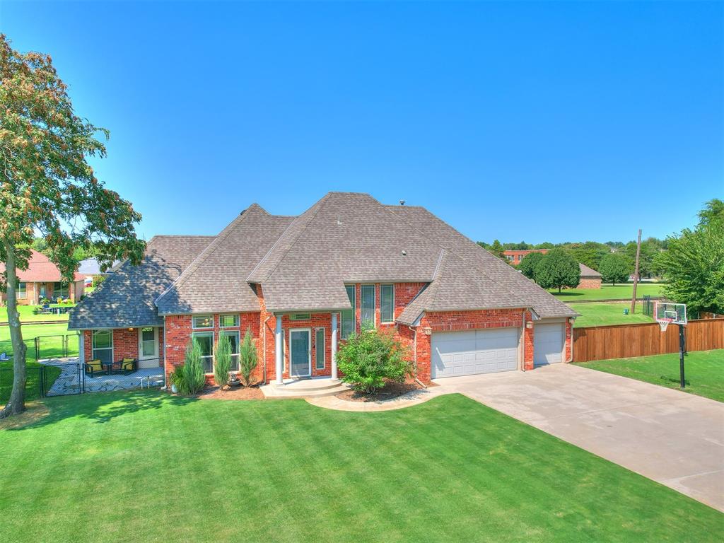THE LOCATION IS INCREDIBLE, WITH PEACE, SERENITY, AND A LARGE GREEN SPACE, YET MINUTES FROM DOWNTOWN OKC, THE CAPITOL, AND VA & CHILDREN'S HOSPITAL. This spacious property blends curb appeal, comfort, and functionality. From the moment you arrive, the manicured lawn, inviting walkway, and stately brick exterior set the tone for what awaits inside. This home truly checks every box - and does it beautifully! Open-concept living areas with soaring ceilings, abundant natural light, and a lovely modern fireplace. A gorgeous kitchen with stylish cabinetry & countertops, stainless steel appliances, center island, and a large breakfast bar with bar seating — perfect for entertaining. Two dining areas include a formal dining space and breakfast nook overlooking the backyard.  In the primary suite you will find high ceilings, spa-style bath including soaking tub, walk-in shower, dual vanities, and a generous walk-in closet. The additional bedrooms are spacious with ample closet space and ceiling fans. Upstairs flex rooms could provide options for a game room, office, or guest retreat.