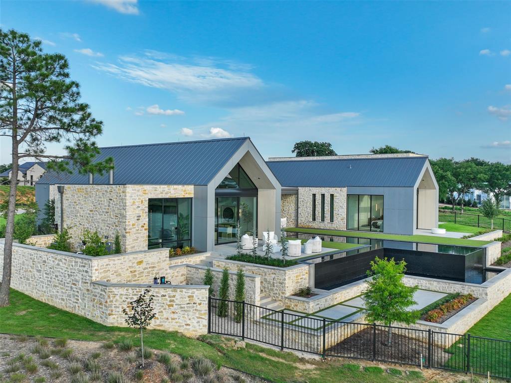 INTRODUCING WATERS EDGE RETREAT!!! WELCOME HOME to this Recently Completed, MODERN WATERFRONT ARCHITECTURAL AND DESIGN MASTERPIECE IN WESTLAKE RANCH!! Built by SCH Homes, the area's most Premiere Luxury Building Team, with the renowned architect Laura Juarez Baggett, with interior and exterior thoughtfully designed by DeLeo and Fletcher, no expense was spared or opportunity missed. Beaming with natural light, walls of glass, lofted detailed ceilings, and modern highest-end finishes, this home gracefully blends exceptional design and outstanding Scandinavian-inspired architecture with its surroundings. Fresh design elements enhance every room. Every room enjoys stunning views as the floor plan maximizes the Lake Front location all while seeming to cantilever towards the lake. The dramatic, negative edge Claffey pool that seems to pour back into the lake. Designed to be an Entertainers Dream, this home will WOW your guests and still provide a comfortable environment for family gatherings. Every room boasts top-end designer lighting, wall coverings, millworks and hardware. Stunning Foyer with wall of reeded glass and custom painted steel detail. Temp-controlled glass Wine Wall separates the Lounge and the Family Room. Pool-spa combo with self cleaning system. 2 custom resin fire pits.  Westlake Ranch offers club-style living with indoor Pickle ball courts and a Clubroom entertainment venue.