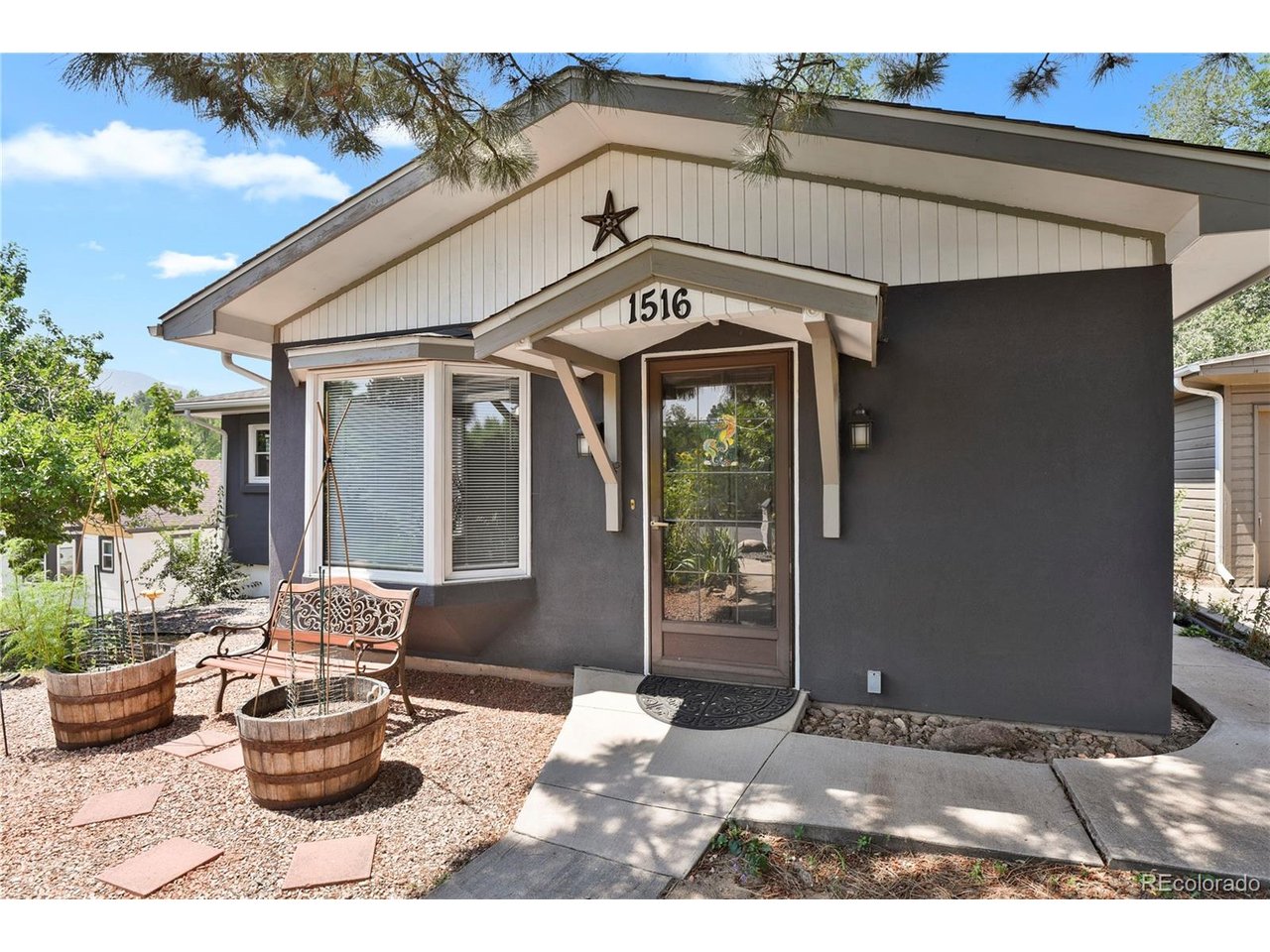 Charm, character, and room to make it your own in the Ivywild neighborhood! This 3-bedroom, 1.5-bath home welcomes you with a large, bright sunroom and hardwood floors throughout the main level. The upgraded kitchen features quartzite countertops, while the partially finished basement offers flexible space and possibilities for the next owner. Outside, enjoy a large, fully landscaped lot and garage space that is hard to find: one attached garage space plus an oversized two-car detached garage with a separate electrical panel and 220V wiring. A neighborhood park is nearby, along with local dining and downtown Colorado Springs. The driveway has a recorded easement with the neighboring property. Come see the charm and potential this Ivywild home has to offer!