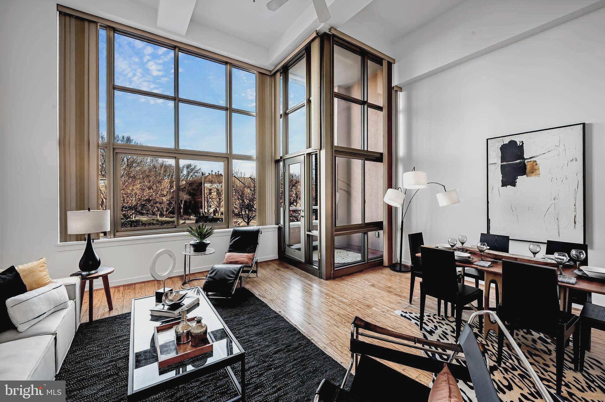 Impressive urban loft condominium in desirable Canton Cove.  This once abandoned warehouse on the waterfront was converted to 89 luxury condominiums incorporating a unique blend of urban lofts and flats.  The spacious 1 Bedroom with Den, and 2 full Baths residence boasts 1,374 sq. ft. of contemporary living space on two levels. The home features on the main level an inviting foyer, dramatic living/dining area with 18’ ceilings and a wall of windows, cozy Den which could function as a second bedroom, sleek white kitchen, full Bath, and a laundry area.  The Primary Bedroom, Bath, and walk-in closet are located on the mezzanine loft. Property enhancements include handsome eucalyptus engineered hardwood flooring on the main level and laminate plank flooring on the second level, stainless steel appliances, ceiling fan, great closet space, and balcony overlooking the Canton neighborhood. One outside parking space #20 conveys.  Additional parking may be available at a minimal monthly fee.  The building provides 24-hour front desk staffing and security monitoring. Gas and water usage are included in the monthly condo fee.  Residents and their guests can enjoy and relax on the expansive roof terrace with spectacular views of the city skyline, the Baltimore Harbor, Ft. McHenry, and fireworks. A library/conference room is also available to residents.  Canton Cove is located within walking distance of Canton Crossing, “The Square”, restaurants, bars, supermarkets, shopping, parks, and cultural events.  Within proximity are Downtown Baltimore, Patterson Park, recreation and fitness centers, Harbor East, Fells Point, Brewer’s Hill, Johns Hopkins and U of M medical campuses, and major highways.