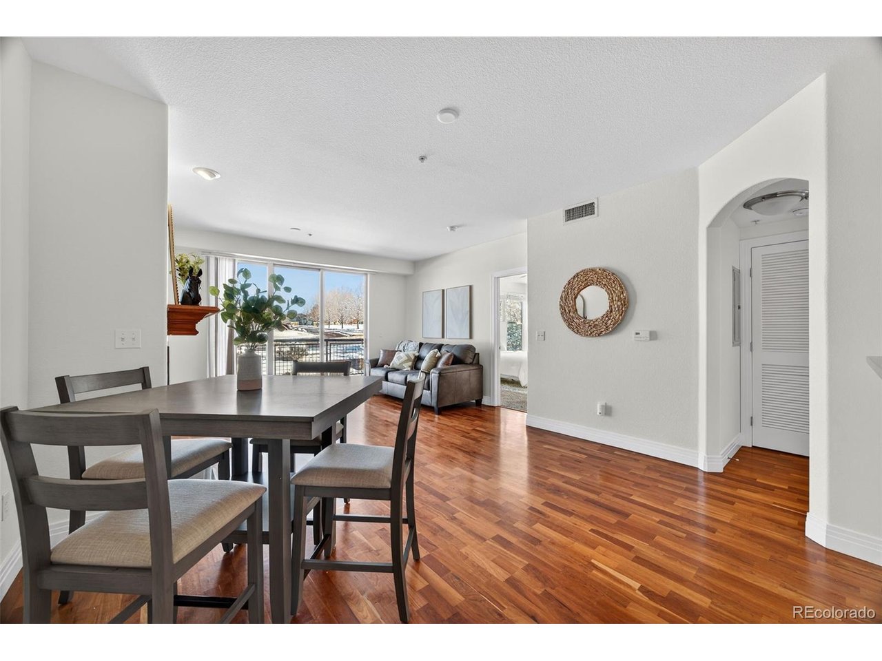 Move-in ready condo with an open floor plan and resort style amenities! The main living space features a cozy gas fireplace and large windows that create a bright and inviting atmosphere. The kitchen offers plenty of cabinet storage and meal prep space and includes stainless steel appliances, a gas range, and modern finishes, making it perfect for everyday cooking or entertaining. The spacious primary bedroom includes a walk-in closet and private en suite bathroom. A second bedroom sits next to a full hall bathroom, ideal for guests, family, or a home office. Step outside to your private balcony, a great place to enjoy Colorado sunsets or your morning coffee. The home also includes in-unit laundry and one heated, secure garage parking space. Residents enjoy easy access to the community clubhouse featuring a pool, hot tub, fitness center, and game room. Conveniently located near I-25, light rail, shopping, restaurants, and outdoor recreation, making commuting and daily living simple.