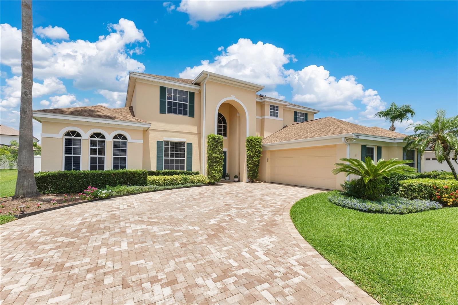 Under contract-accepting backup offers. Tucked into the gated community of Conway Isles, this Belle Isle home makes a strong first impression — mature landscaping, a wide paver driveway, and a double-door entrance that welcomes you in. With nearly 4,000 square feet of living space, five bedrooms, and three and a half baths, there’s room here to spread out without losing that connected feel. Right off the entry, the layout opens up to a series of connected spaces designed for real life. The first-floor primary suite gives you convenience and privacy, complete with dual walk-in closets, a soaking tub, separate vanities, and a glass-enclosed shower. Down the hall, the kitchen anchors the heart of the home with adjacent dining and family rooms, making it easy to host, relax, or just keep an eye on things while cooking dinner. Just off the living room, you’ll find a large sunroom that adds extra living space for everyday use or entertaining. Upstairs, there’s space for everyone with four more bedrooms that share two full baths, plus there’s a loft area that can flex into a workspace, media room, or homework zone. Out back, the fully fenced yard is ready for pets, play, or a future pool. The community itself adds to the appeal, with a well-maintained playground, sand volleyball court, and a large covered pavilion. There's also a tucked-away path where you can launch a canoe or paddle board into a quiet canal that leads directly to the Lake Conway chain — great for early morning paddles or sunset floats. Zoned for Cornerstone Charter Academy K–12, with priority access for Belle Isle residents, and close to Pinecrest Preparatory too, the school options are solid. And when it comes to location, you’re right in the middle of it all — minutes to SoDo, the airport, and downtown Orlando, with shopping, dining, and entertainment — making everyday errands and weekend outings easy. It’s a home that fits real life, in a neighborhood that’s easy to love.
