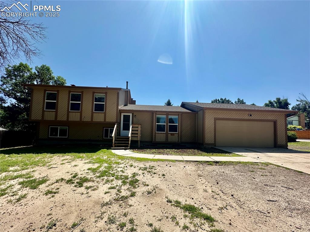 Welcome to equity possibilities with this 4 bedroom, 3 bath, 2 car garage, corner-lot home in La Cresta Vista Grande. Walking in, you'll find the main level containing a spacious living room with open dining room, adjoined to the kitchen, and mudroom, which provides a walk out to the garage and one of two accesses to the backyard. Upstairs you will find the primary bedroom with a connected bathroom, 2 bedrooms, and full bathroom. Enjoy a cozy wood fireplace and room for entertainment in the family room on the lower level, which also includes the laundry room, full bathroom, and second access to the backyard. In the basement, you will find a 4th bedroom and an extra room great for a storage or hobby room. This property has a brand-new roof, newer hot water heater, and furnace. Close to Powers and I-25 corridor, shopping, restaurants, and much more! Come see today!