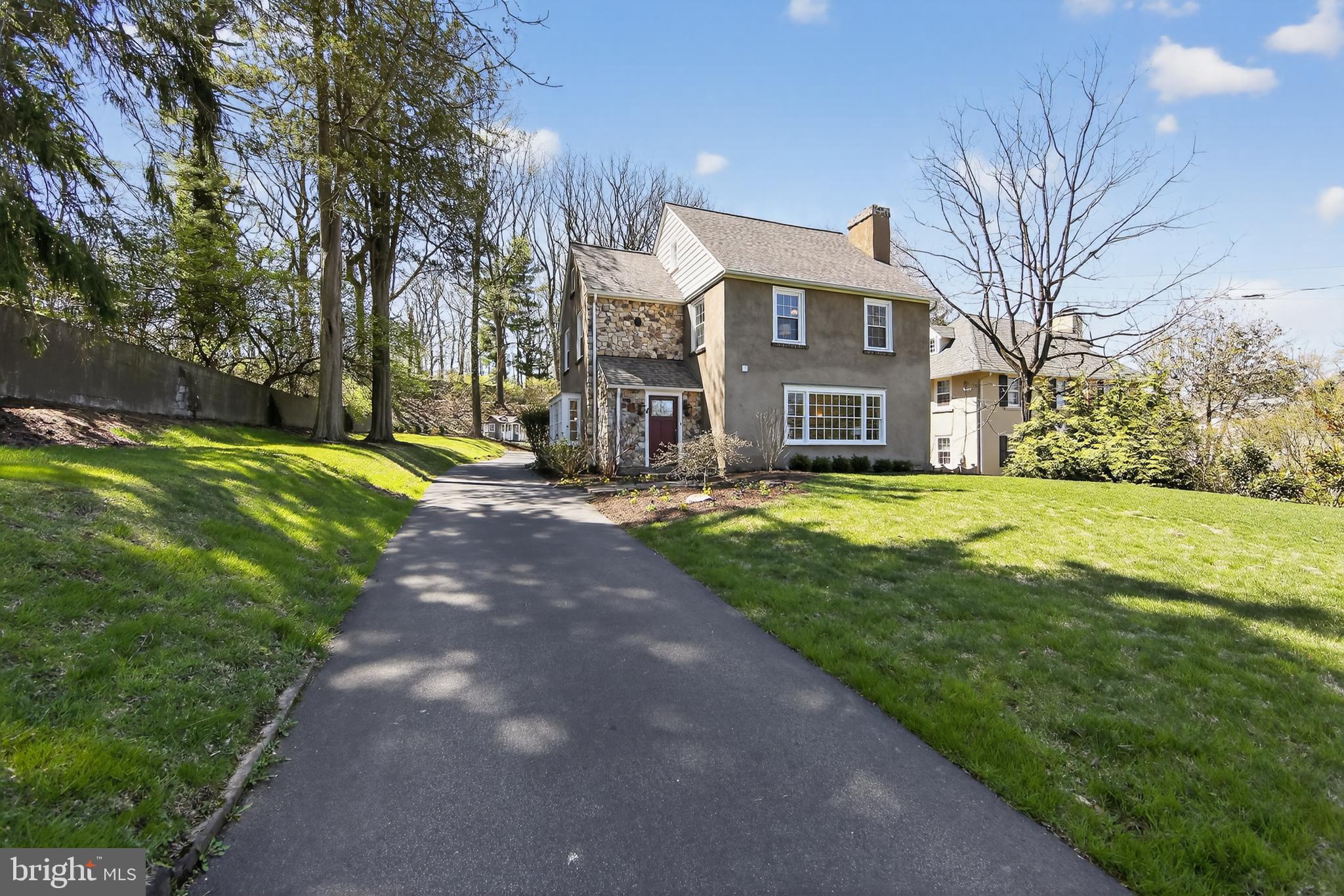 PLEASE NOTE THERE IS AN OFFER DEADLINE OF 5PM, SUNDAY APRIL 12th. 2Nestled in the heart of Radnor Township—just blocks from the charm and vibrancy of downtown Wayne—this beautifully updated Colonial offers the perfect blend of timeless character and modern comfort. With a new roof, freshly painted interior, and private, stone patio with gas firepit and backyard backing to the scenic Radnor Trail, this home is truly move-in ready and designed for effortless living. From the moment you step inside, you’re greeted by gleaming hardwood floors, abundant natural light, and elegant architectural details that create a warm yet sophisticated feel throughout. The welcoming foyer flows into a bright living and dining space framed by expansive windows and classic millwork—ideal for both everyday living and hosting with ease. The formal living room is a true showpiece, featuring floor-to-ceiling custom cabinetry, a cozy fireplace, and a beautiful bay window overlooking the lush front greenspace. At the heart of the home, the spacious, updated kitchen combines style and function with a marble backsplash, peninsula seating, generous cabinetry, and a large window offering peaceful views of the backyard. A rear foyer provides a convenient secondary entrance and easy access to the outdoor living spaces, while a powder room completes the main level. Upstairs, the serene primary suite offers a private retreat with an ensuite bath featuring a walk-in shower and soaking tub. Two additional bedrooms, a hall bath, and linen closet complete the second floor. The third level adds exceptional versatility with a fourth bedroom or home office, an updated full bath, and abundant attic storage.The finished lower level expands the living space even further, offering multiple flexible areas perfect for a media room, home gym, or office, along with a dedicated laundry room with utility sink and ample storage. Step outside and experience a backyard that truly sets this home apart. Thoughtfully designed for entertaining and relaxation, the expansive stone patio is anchored by retaining walls and enhanced with beautiful landscaping and ambient lighting. Multiple seating and dining areas invite gatherings of all sizes, while the gas firepit creates the perfect setting for cozy evenings under the stars. Just beyond, a detached two-car garage and additional parking add convenience, with direct access to the beloved Radnor Trail—bringing nature right to your doorstep.All of this, just minutes from Wayne’s vibrant shops, dining, Radnor Library, Wayne Art Center, and within the award-winning Radnor Township School District.