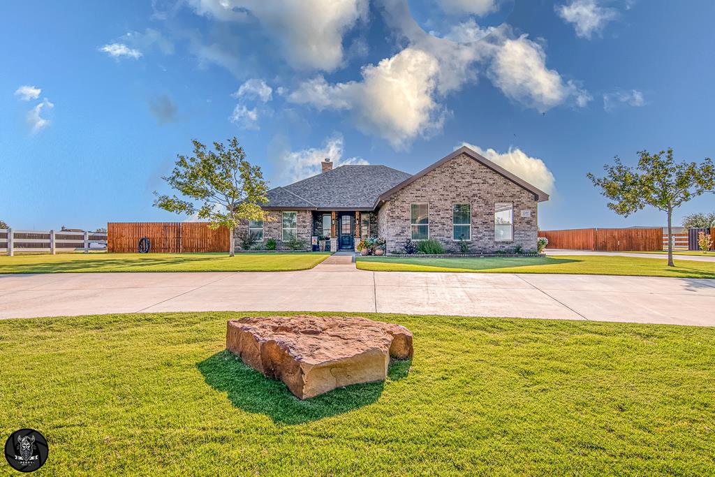 Live like every day's a getaway in this stunning 3/2 home where style meets comfort. Inside, an open kitchen flows into a light-filled living space with a statement fireplace, creating the perfect backdrop for gatherings. Beyond the walls awaits your private paradise: a sparkling pool with serene water feature, lush landscaping, & plumbing/slab ready for your outdoor kitchen. A whole-home generator ensures year-round peace of mind. The tree-lined lot offers privacy, while the 40 by 50 insulated shop with full bath, side garage, & gated rear entry elevates both convenience & sophistication.