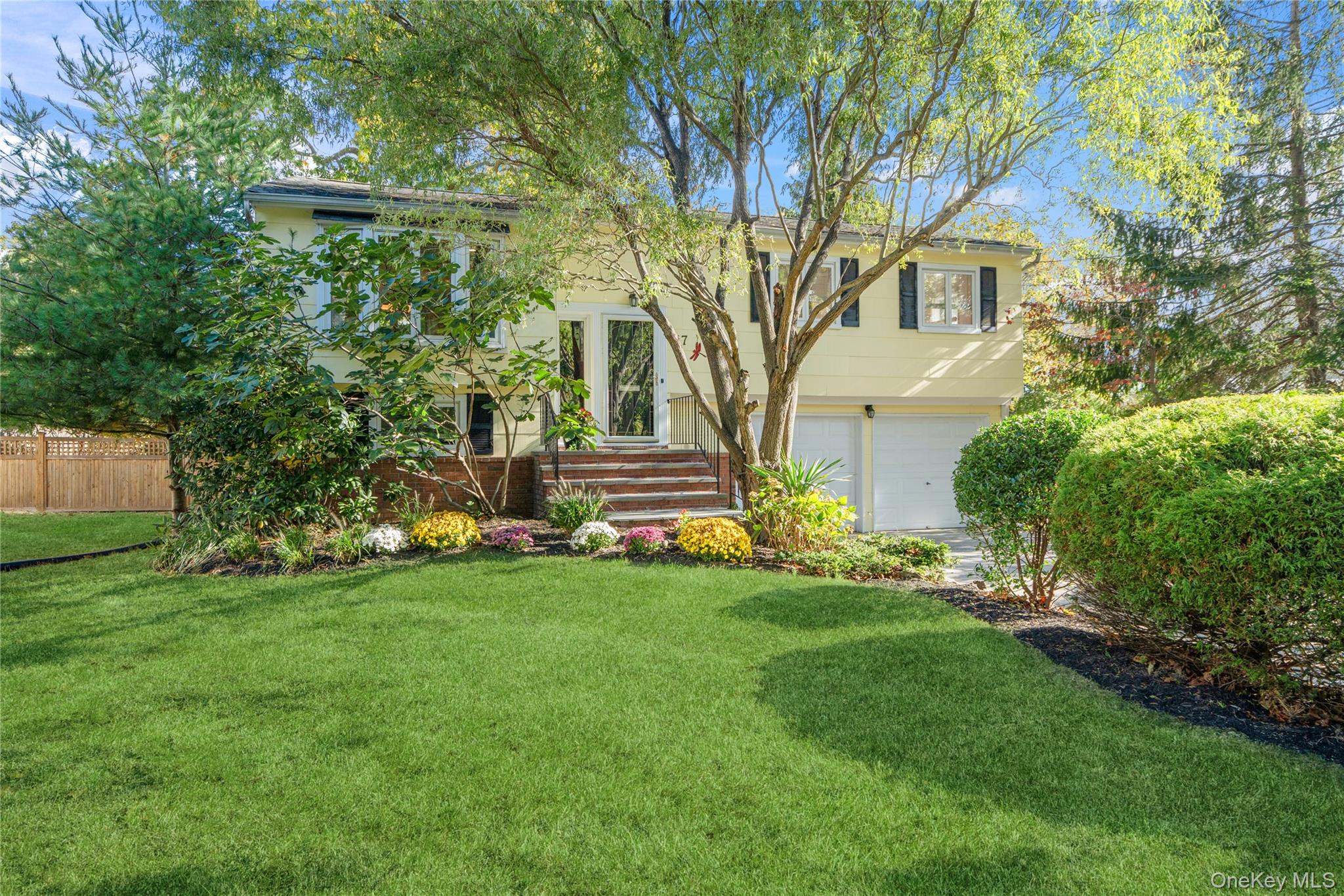 Beautifully Renovated and Lovingly Maintained Hi Ranch Home with 1,900+/- Square Feet Located in the Lawrence Farms Section of Bay Shore Just North of Montauk Highway Within Walking Distance to the Restaurants and Shops of Main Street. Situated Across the Street with a Private View of Trees. Enter onto a Large Concrete Driveway with Parking for 6 Cars into the Entry Foyer. Top Floor has Living Room with LED Hi Hats, Formal Dining Room Open to the Living Room and Kitchen, Updated Kitchen with Granite Counters, Cathedral Ceiling, Hi Hats and New Frigidaire Fridge and Stainless-Steel Appliances, Primary Bedroom, Full Bath with Tub & 2nd Bedroom that is Combined from Bedrooms 2 and 3. Ground Level has Large Closet Under Stairs, 2 More Bedrooms, Full Bath with Shower, Laundry Room with Washer, Gas Dryer & Utility Sink, and Private Guest Quarters with Summer Kitchen, Ductless Heat & CAC Unit, Full Bath with Shower and Door to Side Yard with Patio. Gas Hot Water Heat with Gas Hot Water Heater and Central Air Conditioning and Ductless Unit. 150 Updated Electric. Fenced Property Size of 75' x 150'. Low Taxes of $13,502. No Flood Insurance Required.  VIRTUAL TOUR:  https://sites.allmediatours.com/17lanierln