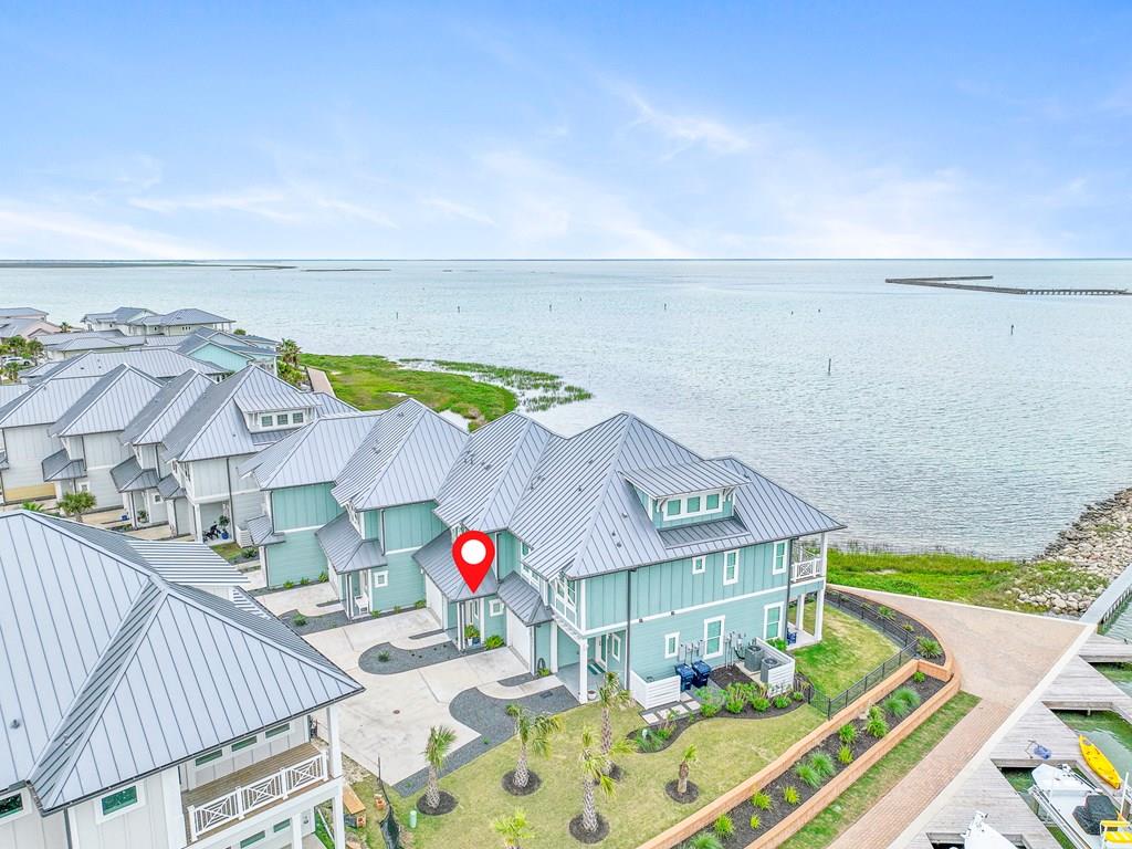 BAYFRONT VILLA | BOAT DOCK | Breathtaking views from every room at this bay side villa. Cool crisp palette tall ceilings and unrestricted views. Gorgeous design not only in this villa but throughout the gated community. Enjoy coffee on your private deck, just off the master bedrooms. Dinners can be enjoyed al fresco on the main level patio. 602 boasts a Golf Cart to toodle around in!  Short term rentals allowed so invest AND enjoy. There's a full range of amenities that The Reserve of St Charles Bay offers, the mile-long boardwalk on the bay, private pier, fish cleaning station, green underwater lights, bay front pool, hammock park & more! Own your piece of the coast with this beautiful waterfront Villa that is “lock and leave” luxury at its best! Note that the Villa is a CONDO. HOA fees include the windstorm & flood insurance. Tax rate includes LID assessment, which maintains all canal bulkheads.