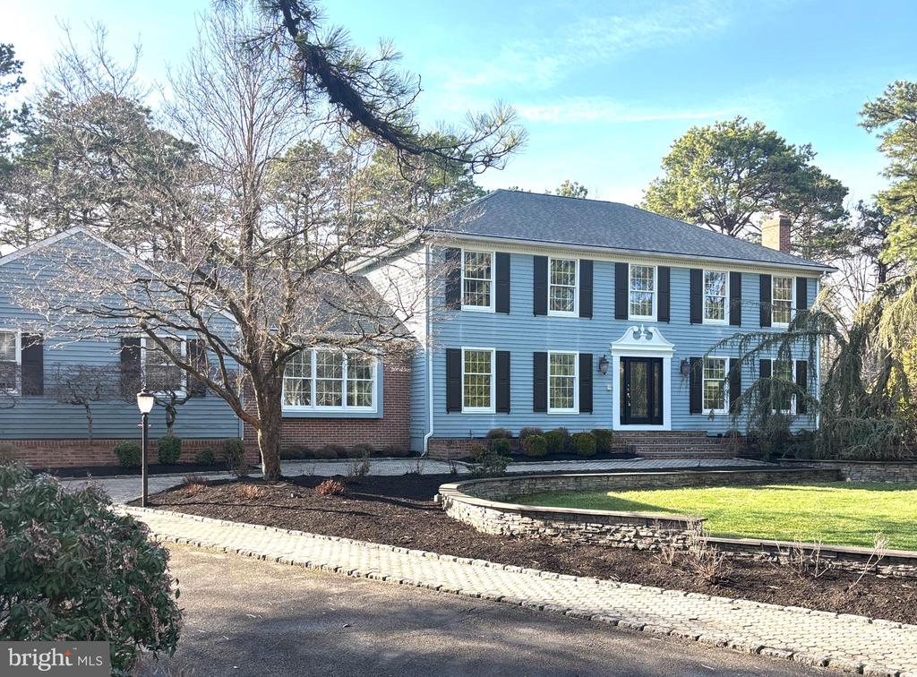 Nestled within the prestigious Highbridge neighborhood of Medford, 3 Aldworth Court is the custom-designed oasis you have been waiting for! Set on a 1.1-acre landscaped lot, this beautiful move-in ready Medford home boasts over 4,000-square feet of living space. Step through the impressive entryway with a curved staircase, to the grand foyer with custom woodwork and careful attention to details complete with elegant hardwood flooring. To the left is a formal dining room with entrance to the kitchen. To the right is a formal living room complete with a gas fireplace.  The perfect place for entertaining! A chef’s kitchen has brand-new GE Café-line appliances that include a refrigerator with both hot and cold water and a 36-inch gas range with 6 burners; wine fridge; and coffee bar; brand-new custom cabinets; large island with quartz countertops.  Off the kitchen is an extensive Trex deck that runs the entire length of the home; a great spot to enjoy your morning coffee and enjoy the quiet scenic view. The open-concept kitchen is adjacent to a spacious family room with an additional gas fireplace.  The first level is complete with a mud room; laundry room; powder room; and a bonus room, ideal for a home office, a fifth bedroom, or playroom.  The lower level is another fully finished 1,100-feet of living space!  On the second floor, you’ll find four large bedrooms.  The hall bath has been upgraded to include a new vanity with a custom quartz top, steam shower, heated towel bar, and heated floors.  The primary bedroom has his and her walk-in closets, and an ensuite bathroom with custom tile shower, soaking tub and a new vanity with dual sinks.  New floors and freshly painted throughout!  Plenty of recessed lighting and natural light, including skylights in the two upstairs bathrooms.   A two-zone heating and air-conditioning system offers greater efficiency.  On a private court, the residence has a large curved driveway and two-car garage.    Situated in the sought-after Highbridge neighborhood, known for its expansive homes and serene ambiance, this prime property enjoys a large yard with beautiful trees, offering a unique blend of sophistication and tranquility. Residents enjoy an exceptional living experience with proximity to top-rated schools, lush parks, and the charming amenities of Medford, making it an ideal setting for a discerning homeowner.