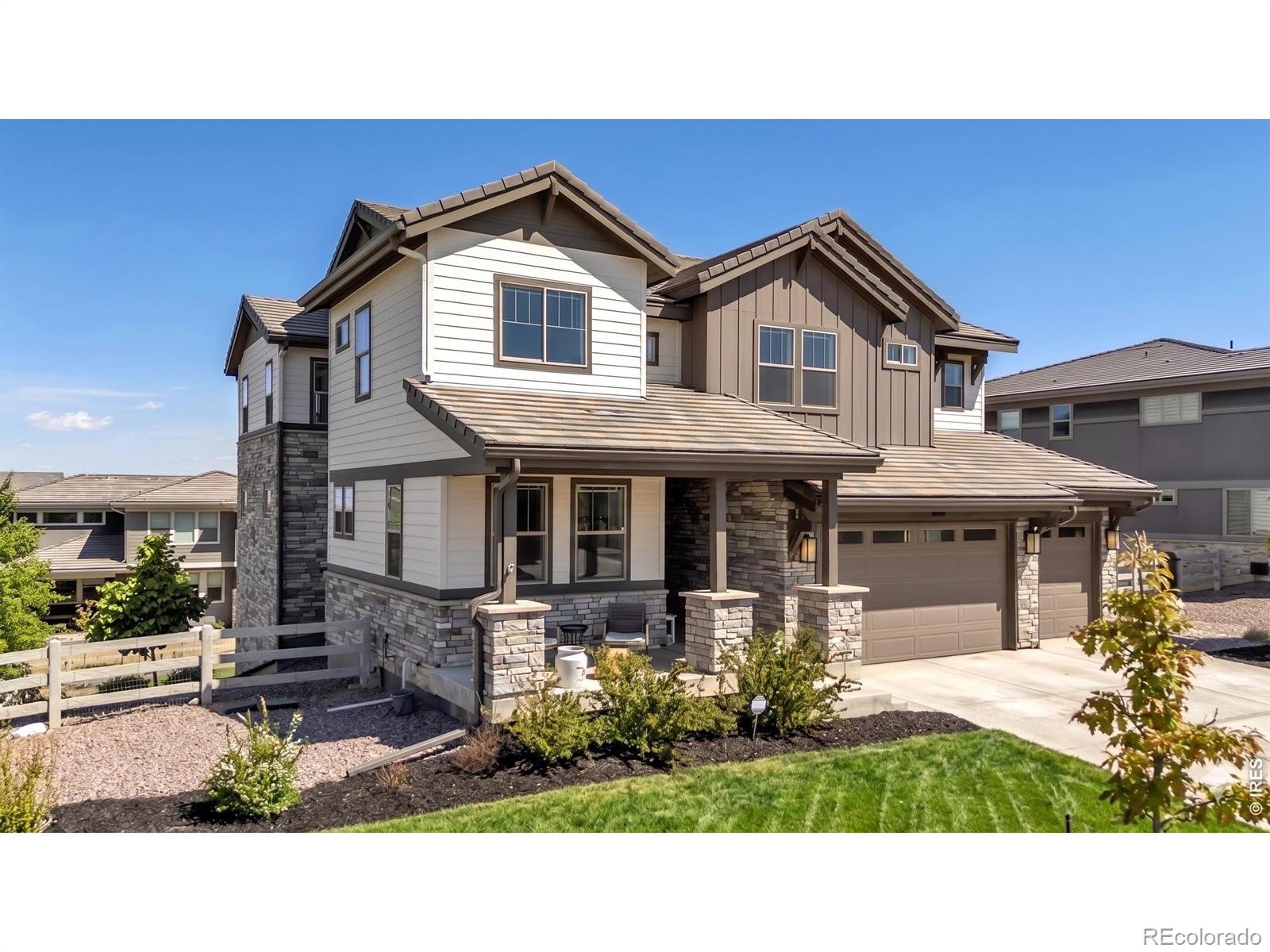 Welcome to Anthem Reserve! This expansive, light-filled home pairs sophisticated style with thoughtful design and a versatile layout in one of Broomfield's most desirable communities. At the heart of the home is a well-appointed kitchen featuring a large island with built-in dining, premium appliances, and a custom wine room. The layout flows naturally into the family room with gas fireplace, creating an ideal space for everyday living and entertaining. An oversized covered patio extends the main living area outdoors and captures terrific Front Range views. Near the entry, a versatile front room works equally well as a formal dining room or sitting area, while the bright main floor office provides an ideal work-from-home setup. Upstairs, the layout is thoughtfully designed for privacy and quiet. The loft and bedrooms are well separated from the main living spaces, minimizing noise transfer from the kitchen and family room below. The primary suite features a perfectly-sized luxury bath and generous walk-in closet with direct access to the laundry room. An en-suite bedroom plus two additional bedrooms connected by a Jack-and-Jill bath complete the upper level. The finished walk-out basement expands the living options with a wet bar featuring a full-size refrigerator and dishwasher, multi-use recreation space, and a fifth bedroom with full bath for guests. A rare four-car tandem garage and wide driveway are integrated into one continuous garage bay configuration for exceptional functionality. Just inside, the oversized mudroom includes a beverage refrigerator, coat closet, cabinetry, and extra counter space creating the perfect landing zone for daily life. Enjoy Anthem's outstanding amenities including a recreation center, pools, fitness facilities, parks, ponds, trails, and neighborhood schools just moments away. Convenient access to DIA, Boulder, plus nearby shopping, dining, and recreation. SHOWINGS BEGIN ON SUNDAY 5/17.