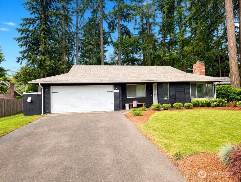Turn-key rambler in a centrally located Gig Harbor neighborhood offering comfort, convenience, and easy single-level living. Filled with natural light, this inviting 3-bedroom, 1.5-bath home features warm hardwood floors, an open flow between living and dining spaces, and a cozy gas fireplace that anchors the living room. The spacious dining area is bathed in natural light and opens seamlessly to the main living spaces—ideal for everyday living or entertaining. The primary bedroom includes a convenient half bath, while two additional bedrooms offer flexibility for guests, office space, or hobbies. Outside, enjoy a fully usable 0.20-acre lot with garden space and raised beds ready for your favorite vegetables, flowers, or summer projects. The backyard & patio offer room to relax, play, or entertain beneath mature trees. Conveniently located near Hwy 16, shopping, dining, and everyday amenities, this move-in-ready home combines peaceful living with excellent access to everything Gig Harbor has to offer.