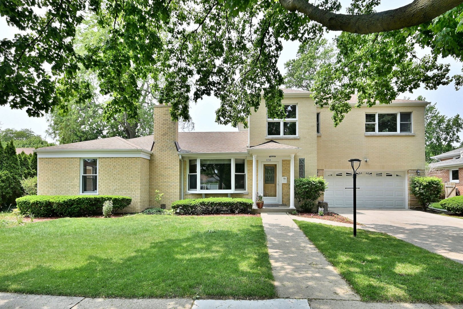 Come and Fall in Love! Welcome to this stunning, move-in-ready home offering a perfect blend of modern updates and classic charm. Step inside to a formal living room with fireplace that flows effortlessly into the beautifully renovated kitchen, complete with a large island, stainless steel appliances, and quartz countertops-ideal for both everyday living and entertaining.This home boasts four generous bedrooms and three fully remodeled bathrooms, featuring elegant finishes throughout. Gleaming wood flooring and recessed lighting enhance the warmth and style in every room.The newly finished basement with fireplace adds significant living space, including a full bathroom with separate shower, a laundry room, and a versatile bonus room-perfect for a home office, gym, or guest suite.Enjoy the outdoors in your oversized fenced yard, offering plenty of space for gardening, play, or relaxing weekends. An attached two-car garage provides added convenience and storage.
