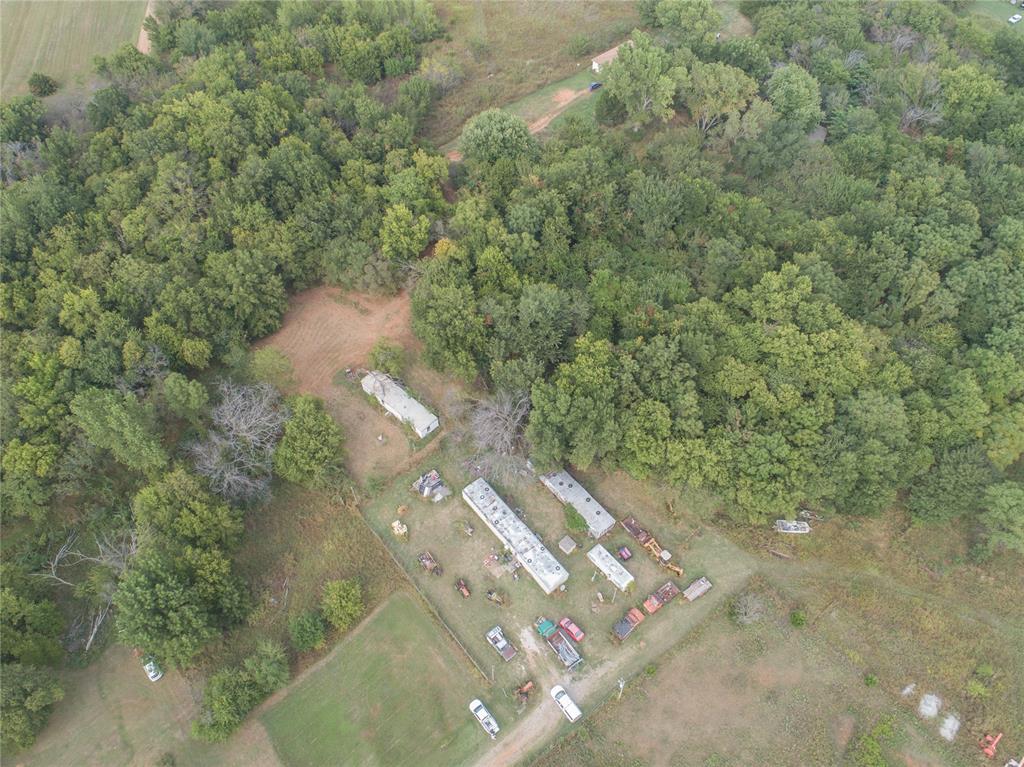 Escape to your own private retreat on this expansive 29.73-acre MOL lot in Edmond. Offering a rare opportunity to own a significant piece of land in a sought-after area, this property features an existing mobile home that can serve as a temporary residence, a potential rental, or be easily removed to make way for your dream build. With its serene setting and ample space, this lot provides a perfect canvas for creating a custom home with all the privacy and acreage you desire, while still being conveniently located. Whether you're an investor looking for a strategic land hold or a buyer ready to build, this is a unique chance to secure a spacious lot with an Edmond address. This property is being sold with the following TAX ID's: 15128, 39408, 39211, 35132, 35182 (see the supplements for descriptions). Buyers are responsible for removing items from the property.