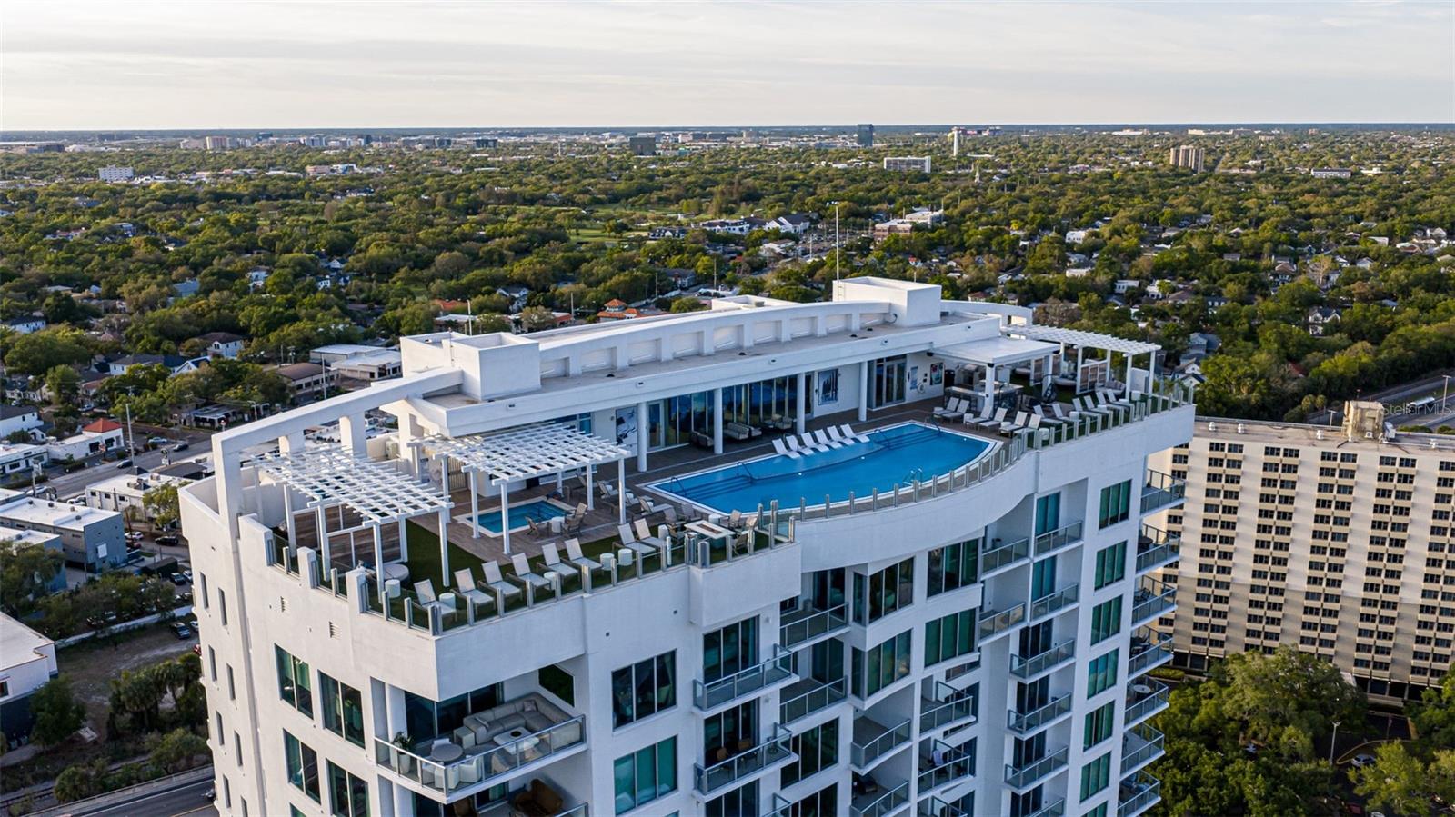 Welcome to luxury condominium living at Altura Bayshore, a boutique building in South Tampa offering elevated, waterfront-inspired living. This four-bedroom, 3.5-bath residence features fully integrated smart home technology and floor-to-ceiling windows showcasing sweeping views of the water and iconic Bayshore Boulevard. From your private foyer, enter to a bright, open-concept layout filled with natural light, where expansive living and dining spaces flow seamlessly for everyday living and entertaining. The designer kitchen connects effortlessly to the main living area, all framed by stunning bay views, and is elevated with Calacatta Gold suede countertops, a waterfall island with additional cabinetry, integrated hood, gas range, wine refrigerator and a separate ice maker. Integrated smart home technology allows you to control lighting, music, shades, temperature and more, all from your phone. The primary suite offers a retreat with a spacious, spa-inspired bath and a custom-built closet, while all closets throughout the home feature thoughtfully designed built-ins for elevated organization. Additional bedrooms are positioned to capture incredible views, with two opening to a private secondary balcony for an elevated indoor-outdoor experience. A bold, designer powder room adds a memorable pop of personality. Enjoy a lifestyle centered around comfort and connection, with private balconies and breathtaking views creating a backdrop for relaxing or entertaining. A well-appointed laundry room with a sink, custom cabinetry, and designer backsplash adds style and functionality. Every detail of this residence has been thoughtfully curated with custom upgrades and modern finishes throughout. In Altura Bayshore, a boutique condominium building in South Tampa, residents enjoy access to a private club room with a gas fireplace, bar and lounge seating, along with a state-of-the-art fitness center overlooking the bay. Amenities also include a putting green, pickleball courts, bocce courts, guest suites and a dedicated dog park. With a 24-hour concierge, secured garage parking with EV charging, and private storage, this is maintenance-free luxury living. Just moments from Bayshore Boulevard, Hyde Park Village and South Howard Avenue, this South Tampa location offers effortless access to some of the area’s best dining, shopping and entertainment, all within the sought-after Plant High School district.