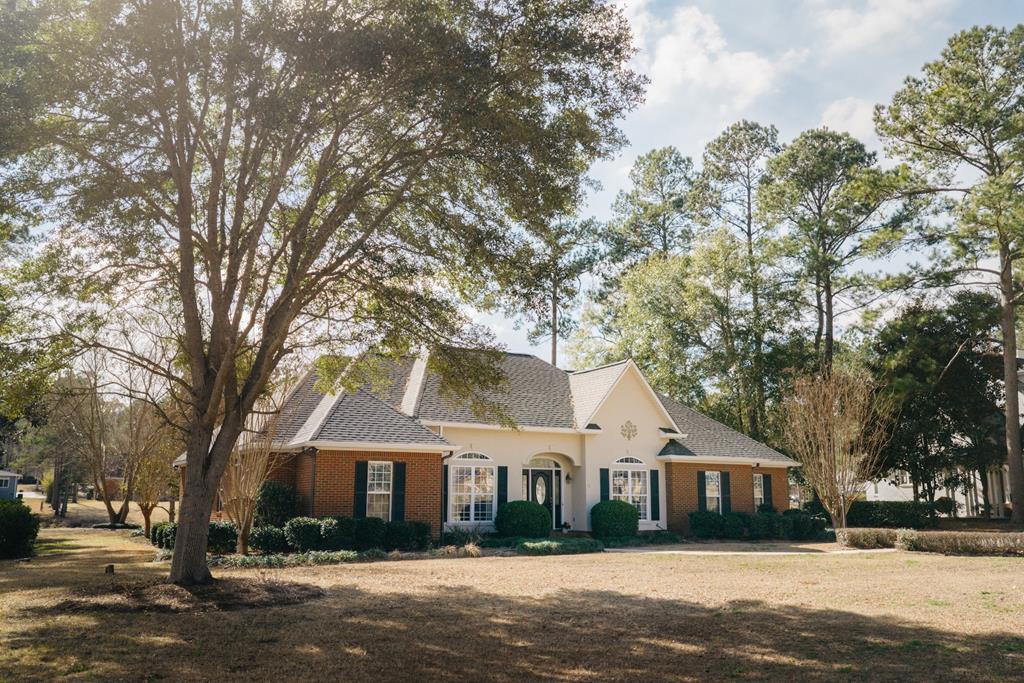 Welcome to this beautiful 4-bedroom, 3-bath home in the highly desirable Polana Subdivision, conveniently located between Thomasville, Georgia and Tallahassee, Florida, and just a short drive to Brookwood School.  This spacious residence features an open, split floor plan designed for both comfort and functionality. The home offers a formal dining room, a versatile office or sitting area, and a well-appointed kitchen with abundant cabinetry and storage. The inviting family room showcases custom built-ins and a cozy fireplace—perfect for relaxing evenings at home.  Step outside to enjoy the screened porch overlooking tranquil water views, ideal for morning coffee or unwinding after a long day. Additional highlights include a two-car garage with extensive built-in storage, attic access, and a separate storage room for added convenience.  Located in a quiet, family-friendly neighborhood, this home combines space, style, and location—making it the perfect place to settle in and enjoy peaceful living with easy access to nearby amenities.