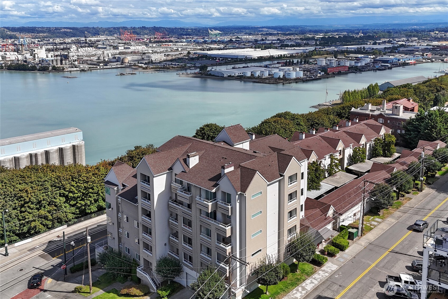 Amazing location in the Stadium District! Easy access to freeways, Theatre District, restaurants and more! Stunning Mountain Views! Beautiful engineered hardwoods throughout plus tile in bathrooms and laundry room. Large primary bedroom with walk-in closet and primary bath. 2nd bedroom has a very large closet and its own access door to hallway. Granite counters and decorative lighting. Stainless steel hot water tank, new dishwasher and tons of storage including multiple pull-outs for convenience. 2 secured/covered/personal parking spaces plus a garage storage unit included. 2 additional storage closets included on balcony.