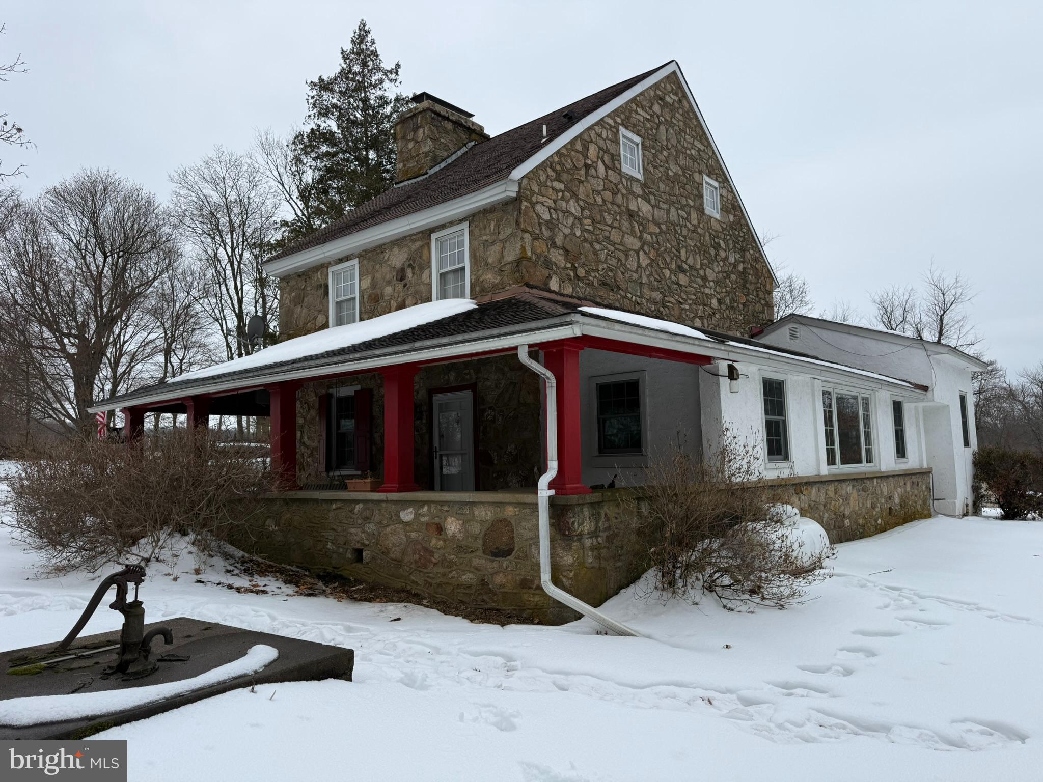 This property is being offered for sale at auction on Friday, April 17, 2026 at 5:00 PM. List price is the suggested opening bid only and is not indicative of the final sale price.REAL ESTATE:  This charming circa 1732, 2½-story, two-bedroom stone farmhouse offers approx. 1,592 SF of living space and sits on 3.89 scenic acres featuring a barn/workshop, fenced pastures, and an inviting in-ground pool.  Originally part of a working dairy farm, the property retains grandfathered rights for unlimited cattle. Behind the home, the land gently slopes down to a spring-fed creek bed bordered by remnants of an old creamery and its original stone walls—adding to the home’s historical character.   Inside, the farmhouse exudes warmth and authenticity, highlighted by exposed beams, 14-inch deep window sills, exposed stone walls, newer Pella windows, and a covered front porch complete with a classic porch swing. Main Level: Enclosed porch with ceiling fan and basement access; Kitchen with gas range, refrigerator, D/W, mini split system and W/D hook-up; Family room featuring a propane stove and vaulted ceiling w/skylights; Living room with a large stone hearth and wood-burning fireplace insert; Dining room with a beautiful stone wood-burning fireplace. Second Level: Primary bedroom with two closets, mini split, and wood-burning fireplace; Full bath with double vanity. Third Level: Second bedroom with two closets, skylights, mini split, and a picturesque view of the property. The home includes a basement with oil hot-air heat. Alternate heating options include the propane stove in the living room, mini splits on each level, and three wood-burning fireplaces. Utilities include an on-site well and septic system.Outdoor features include an in-ground pool; pool house (13’x34’) w/screened porch, changing room & bathroom. 2 Sty. barn/shop (16’x21’)w/elec. and water, 2 attached horse stables (13’x17’) & equipment/hay storage (10’x30’) and Fenced Pastures.NOTE:  Steeped in history and full of character, this unique property offers a rare blend of traditional farmhouse charm and modern comfort amid a peaceful, pastoral setting and yet close to several local cafés and bakeries, parks and historic outdoor spaces like Springton Manor Farm and Wagenseller Park, and markets for everyday needs. For broader shopping, restaurants, and services, travel a short drive to Downingtown, Exton, or Chester Springs, which have more options.  The 2.2 acre lot adjacent to the property will be available to the buyer for purchase.  OPEN HOUSE:  Saturday, March 28, April 4 & 11 (1-3 pm.) or anytime by apt.                                                         TERMS:  10% down day of sale; settlement within 45 days of sale.                                                                                   TERMS BY:  Robert J. and Margaret G. Dunleavy.