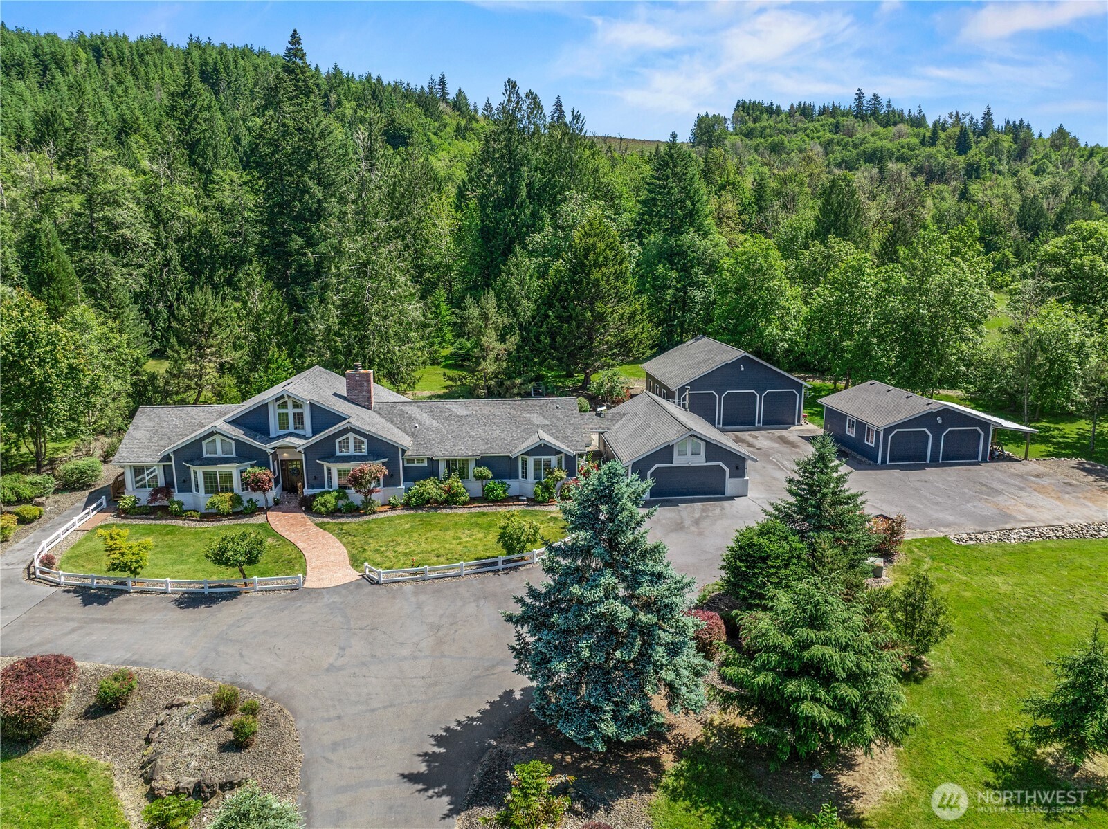 1 Year Lender Paid Buy Down Available with Preferred Lender! Private country retreat on nearly 12 picturesque acres in Mossyrock on 2 tax parcels. This beautifully updated property offers the perfect blend of comfort, functionality, and versatility with a remodeled kitchen featuring new cabinetry, updated flooring, fresh paint interior and exterior, new lighting and more.     Designed for equestrians, hobby farmers, and outdoor enthusiasts, the property features a six-stall barn, accommodations for horses and livestock, full RV hookups, gated entry, mature landscaping, and multiple outbuildings. The detached garage has been converted into a game room and bonus space, while additional garages and shop buildings provide abundant room for vehicles, equipment, and storage.    The home includes two primary suites, a total of 4 bedrooms, three bathrooms, a wood-burning fireplace, and a detached one-bedroom apartment with laundry, full bathroom, and separate electrical service—ideal for guests, multigenerational living, or rental potential. Additional features include radiant heated floors in the primary bath, a whole-property generator, security system hook-ups, and a private hot tub perfect for relaxing after a day spent enjoying the property.     Located just minutes from Mayfield Lake, Riffe Lake, boating, fishing, and year-round recreation, this rare property offers the space, amenities, and lifestyle you’ve been searching for.